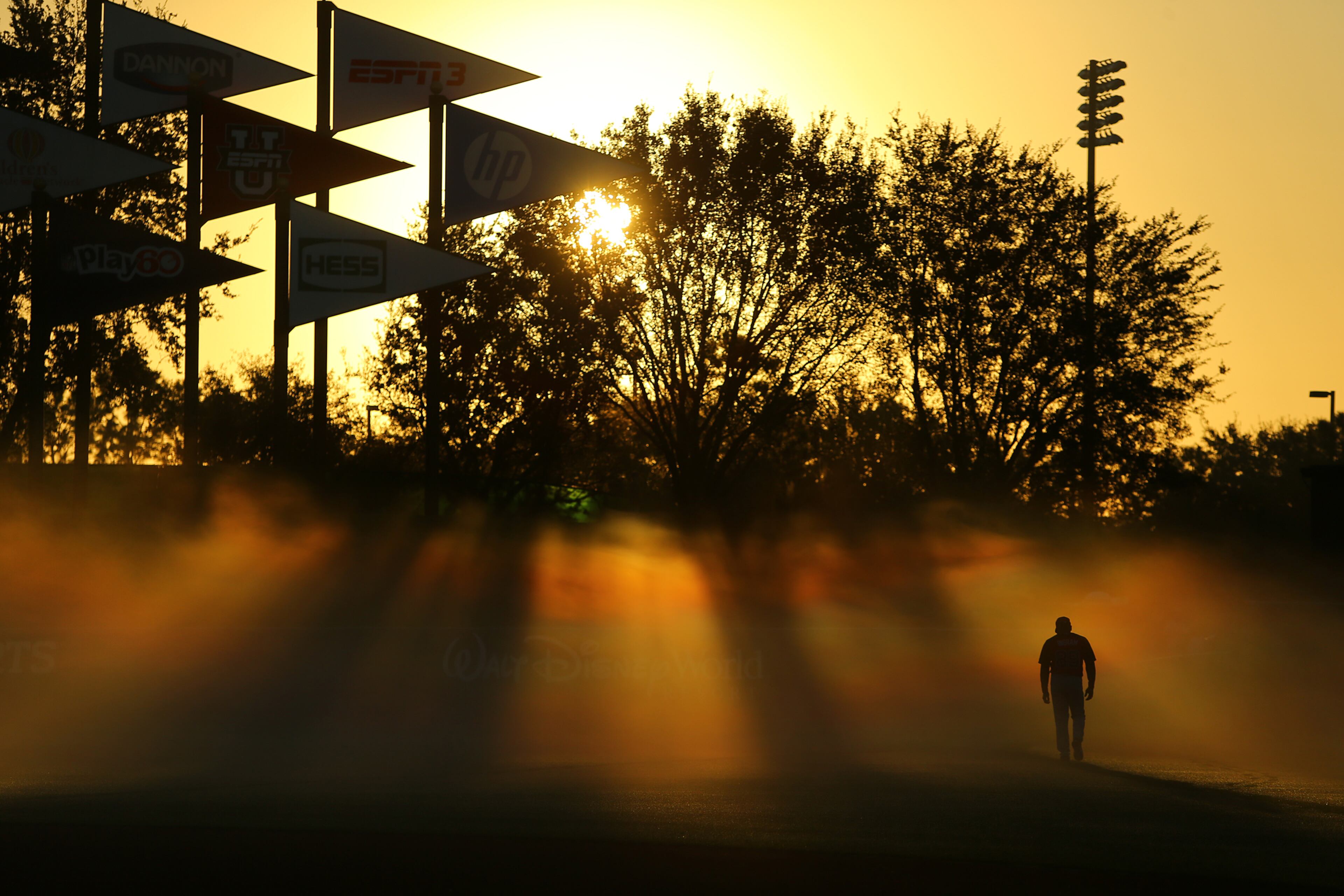 Hitting coach Gary Ingram gets an early-morning start in Lake Buena Vista, Fla.