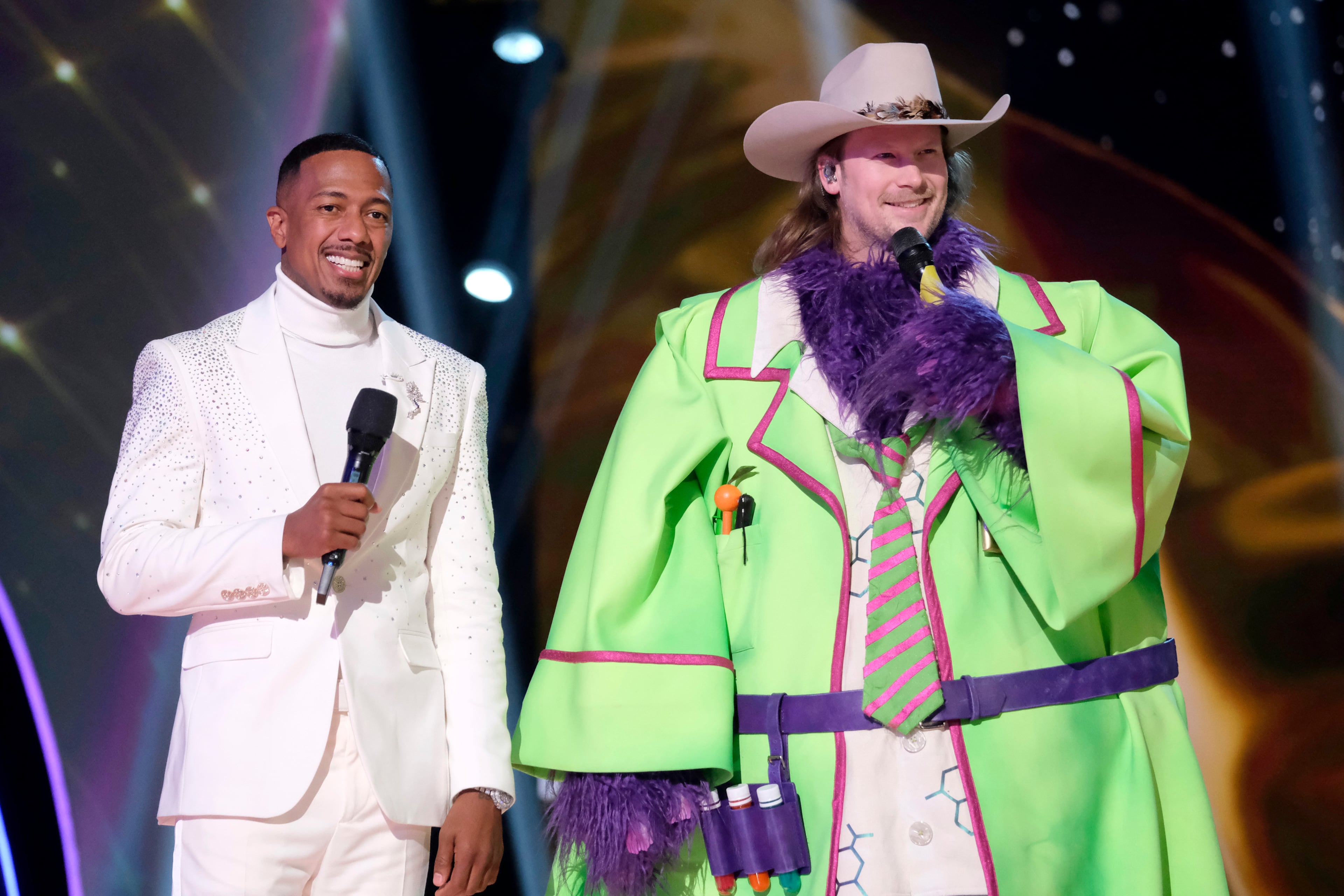 Nick Cannon, shown with Brian Kelley, still hosts Fox’s hit show “The Masked Singer” and remains executive producer. (Michael Becker/Fox)