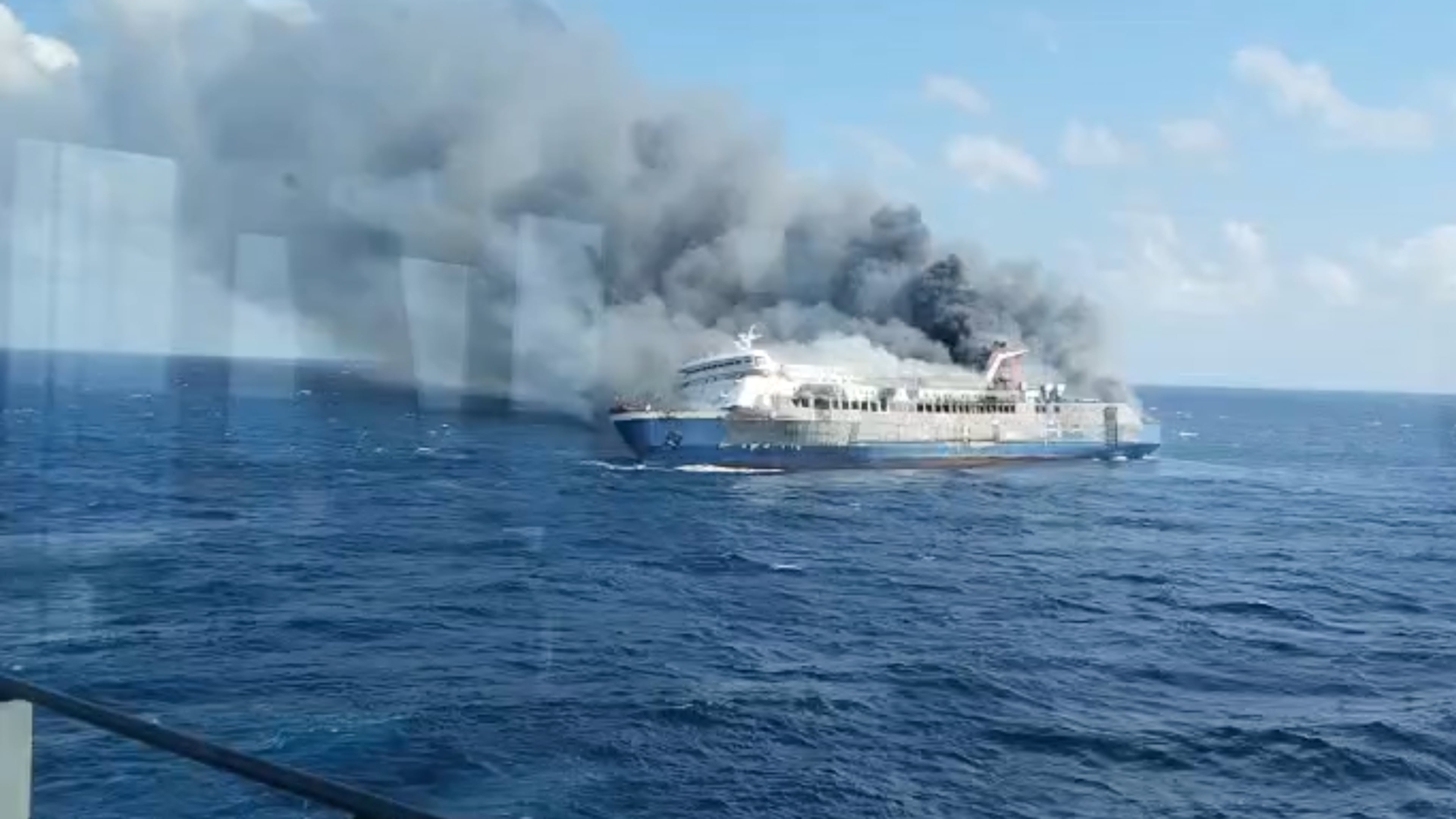 In this photo made from video released by the Indonesian National Search and Rescue Agency (BASARNAS) on Sunday, Aug. 2, 2026, smoke billows from passenger ship Mutiara Santosa 2 after it caught fire in the waters off Madura Island, Indonesia. (BASARNAS via AP)