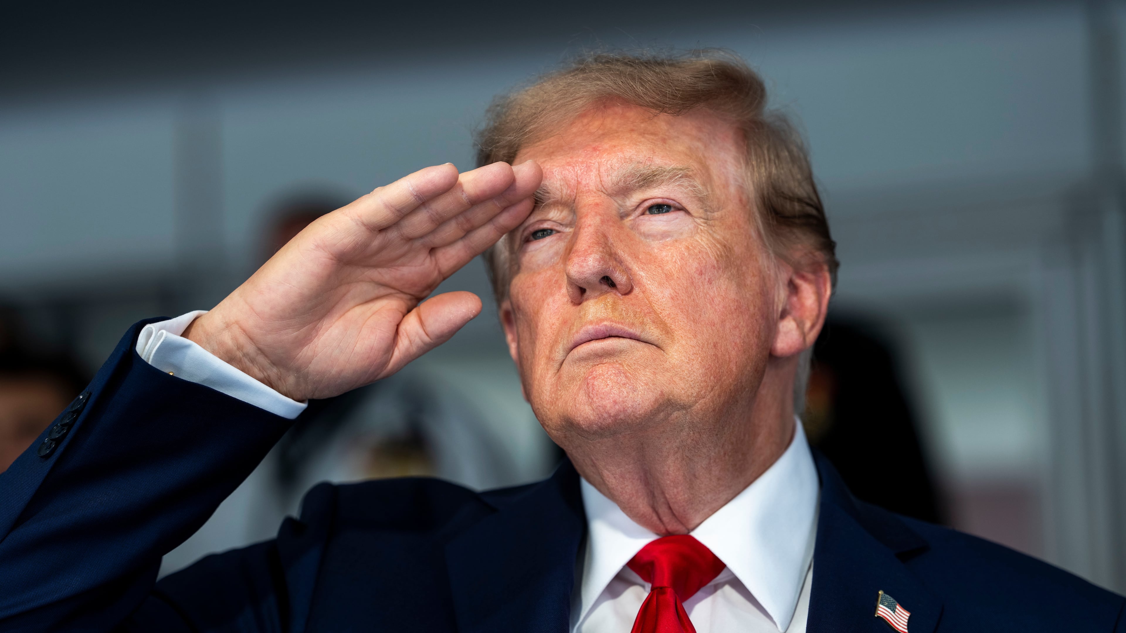 President Donald Trump is pictured during the playing of the national anthem at the IndyCar Freedom 250 Grand Prix auto race, Sunday, Aug. 23, 2026, in Washington. (Doug Mills/The New York Times via AP, Pool)