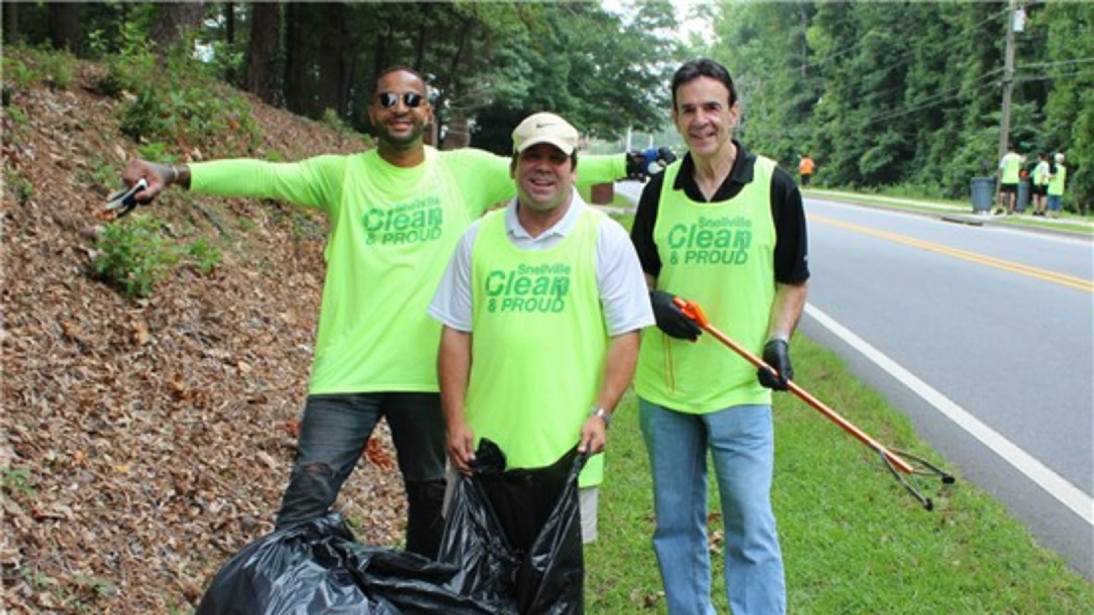 From left Chad Livsey, Joe Wilson and Snellville Mayor Pro Tem Dave Emanuel during a Snellville Clean and Proud work day on Oak Road. (Courtesy City of Snellville)