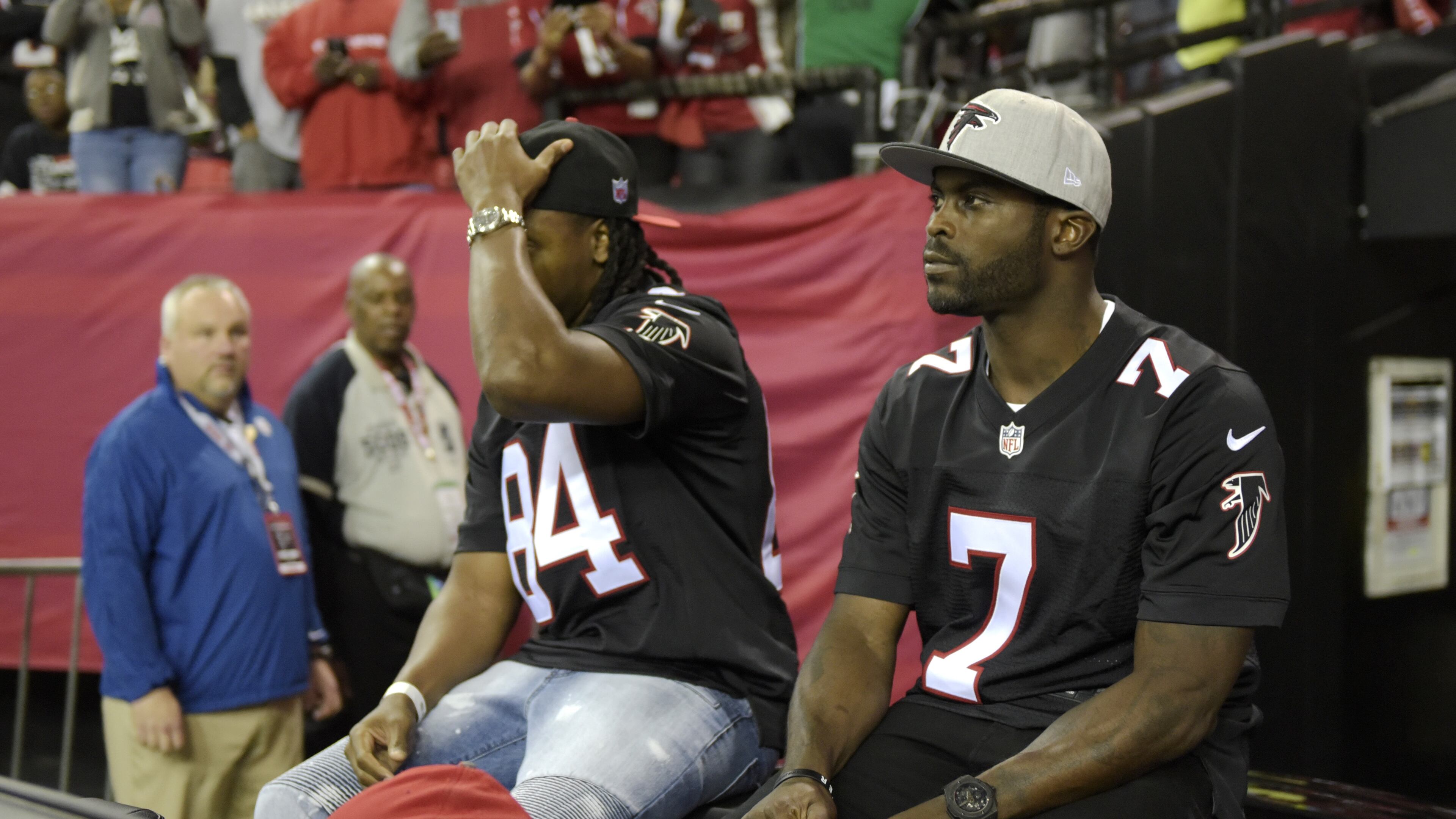 January 1, 2017, Atlanta - Former Falcons quarterback Michael Vick (7) greets fans at the Georgia Dome during the NFL football game against the Saints in Atlanta, Georgia, on Sunday, January 1, 2017. (DAVID BARNES / DAVID.BARNES@AJC.COM)