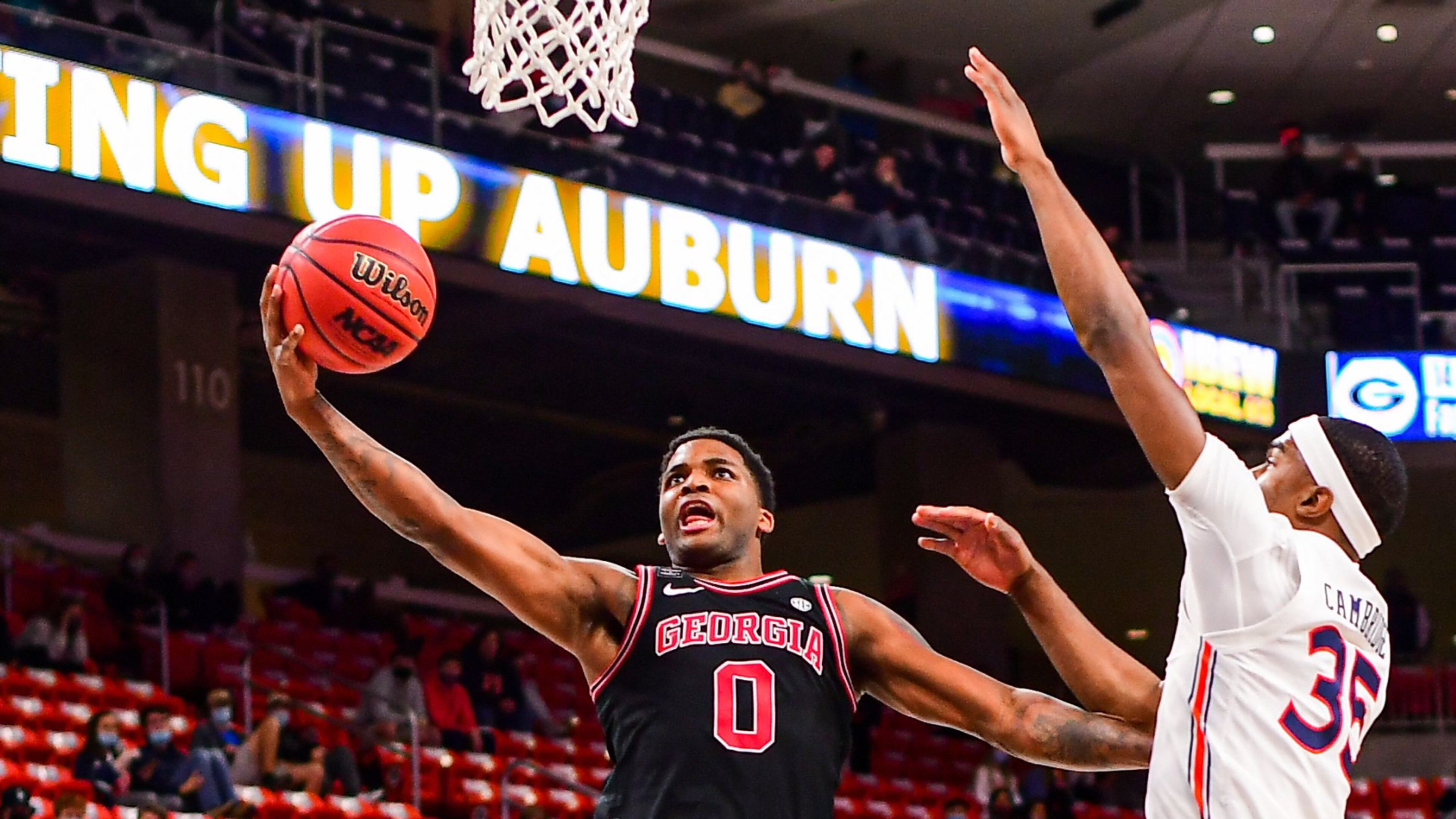 Georgia basketball player K.D. Johnson (0) goes up for to score two of his 12 points in Wednesday night's 91-86 win over Auburn at Auburn Arena. Johnson was one of six Bulldogs to score in double figures. (Shanna Lockwood/AU Athletics)