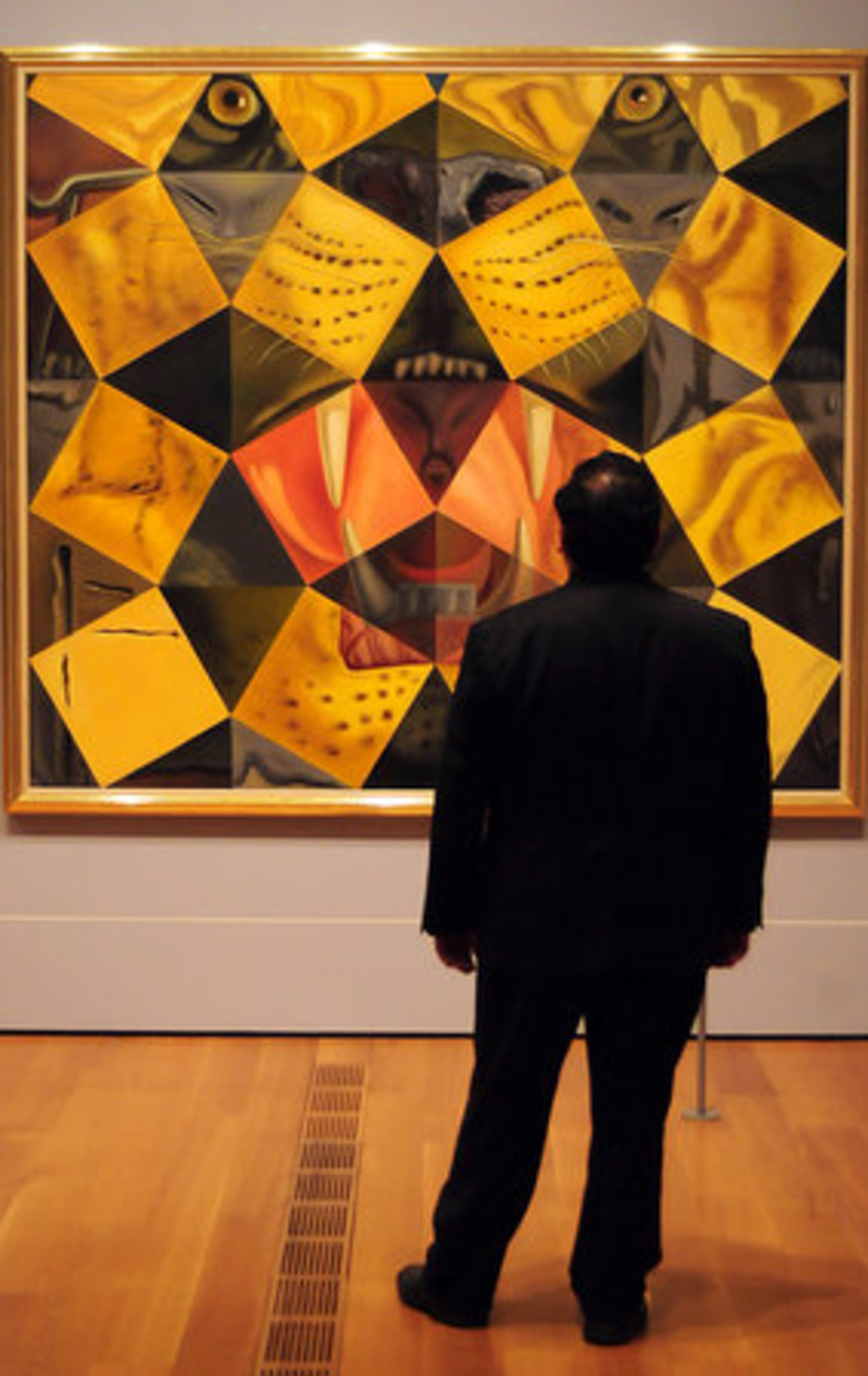 A vistor looks at Salvador Dali's painting "Royal Bengal Tiger."