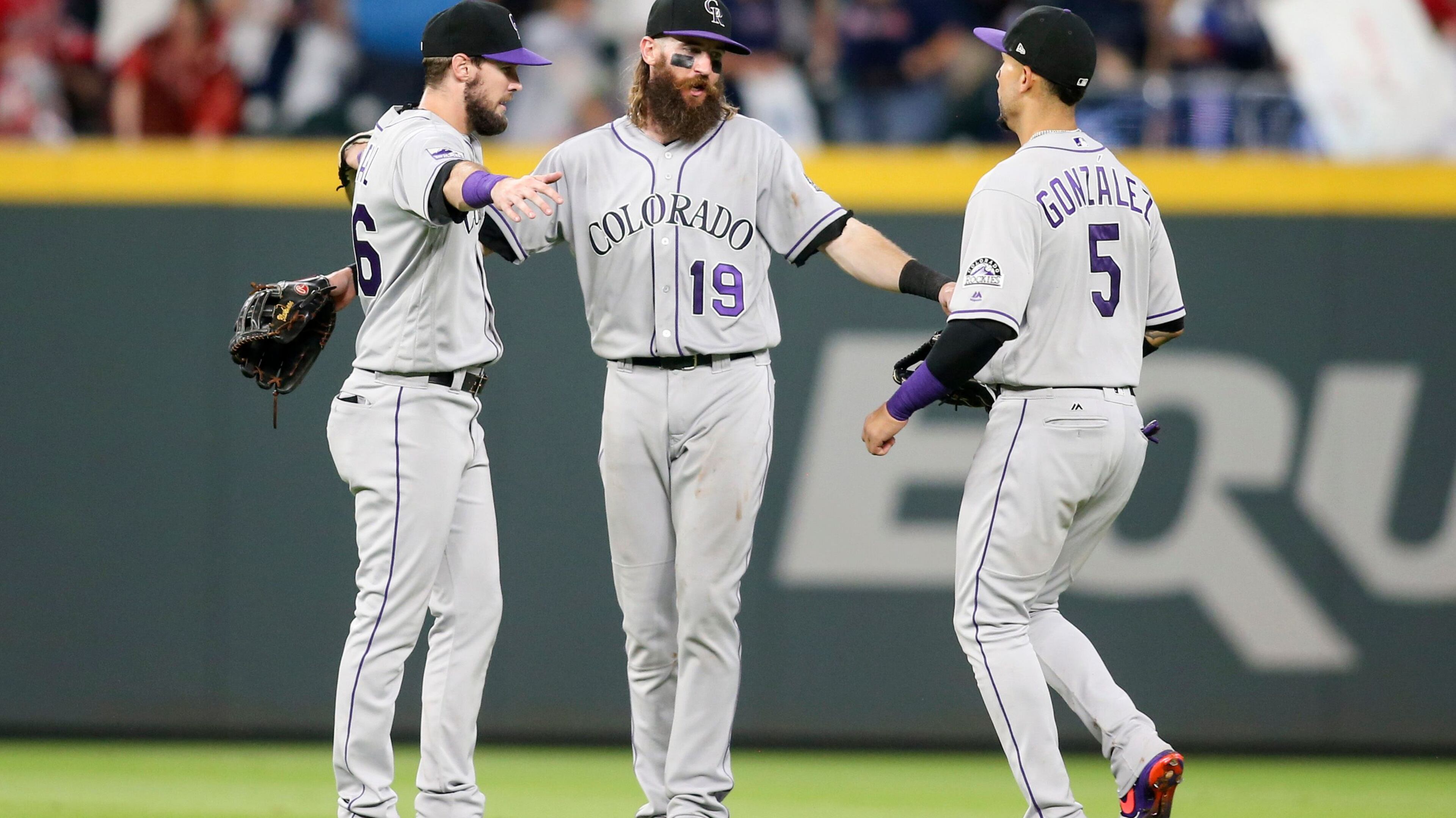 The Rockies did a lot of celebrating at SunTrust Park. Left to right: David Dahl Charlie Blackmon and Carlos Gonzalez.