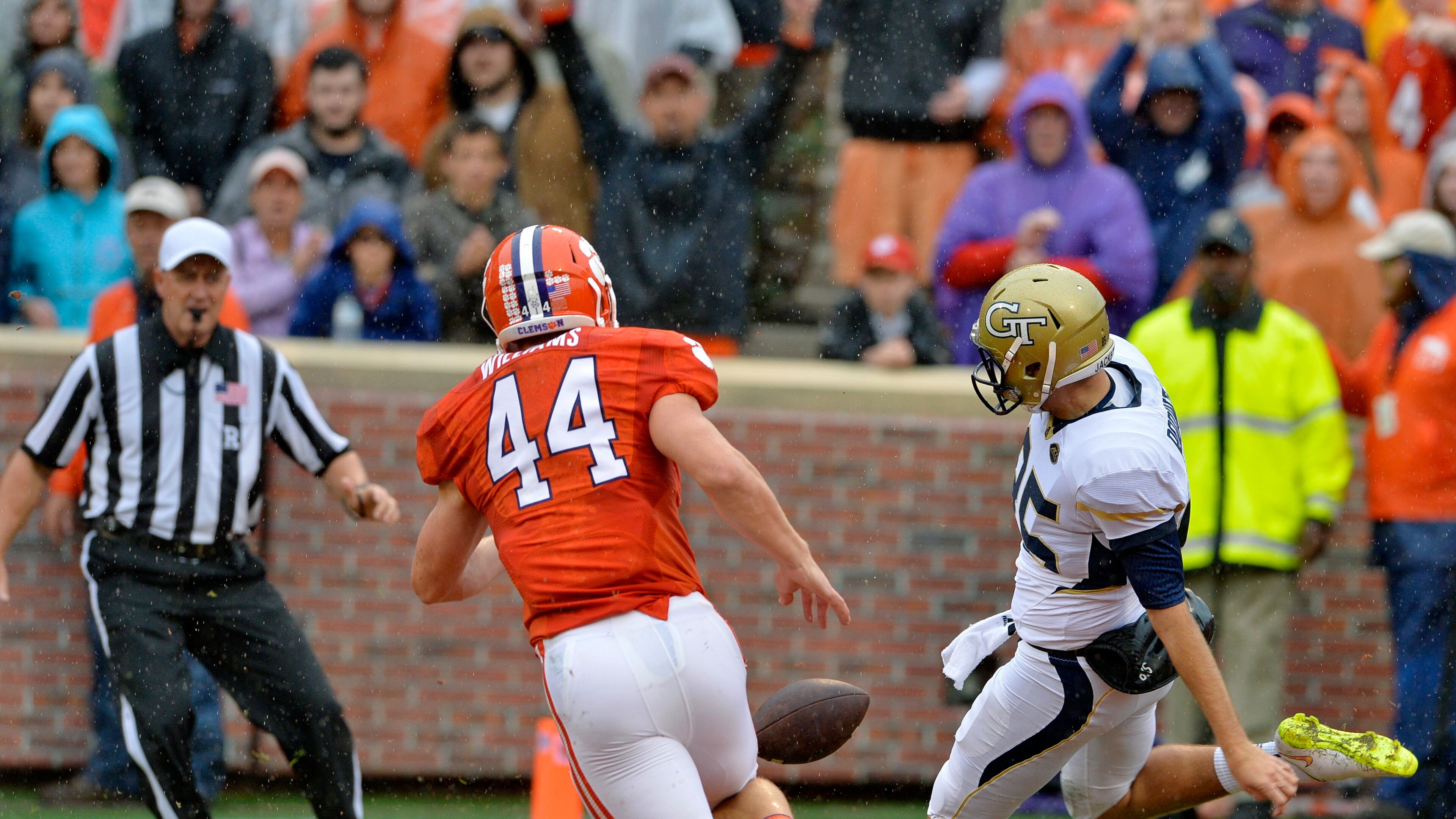 Georgia Tech punter Ryan Rodwell is pressured by Clemson's B.J. Goodson in the end zone resulting in a touchback during the first half of an NCAA college football game Saturday, Oct. 10, 2015, in Clemson, S.C. (AP Photo/Richard Shiro)