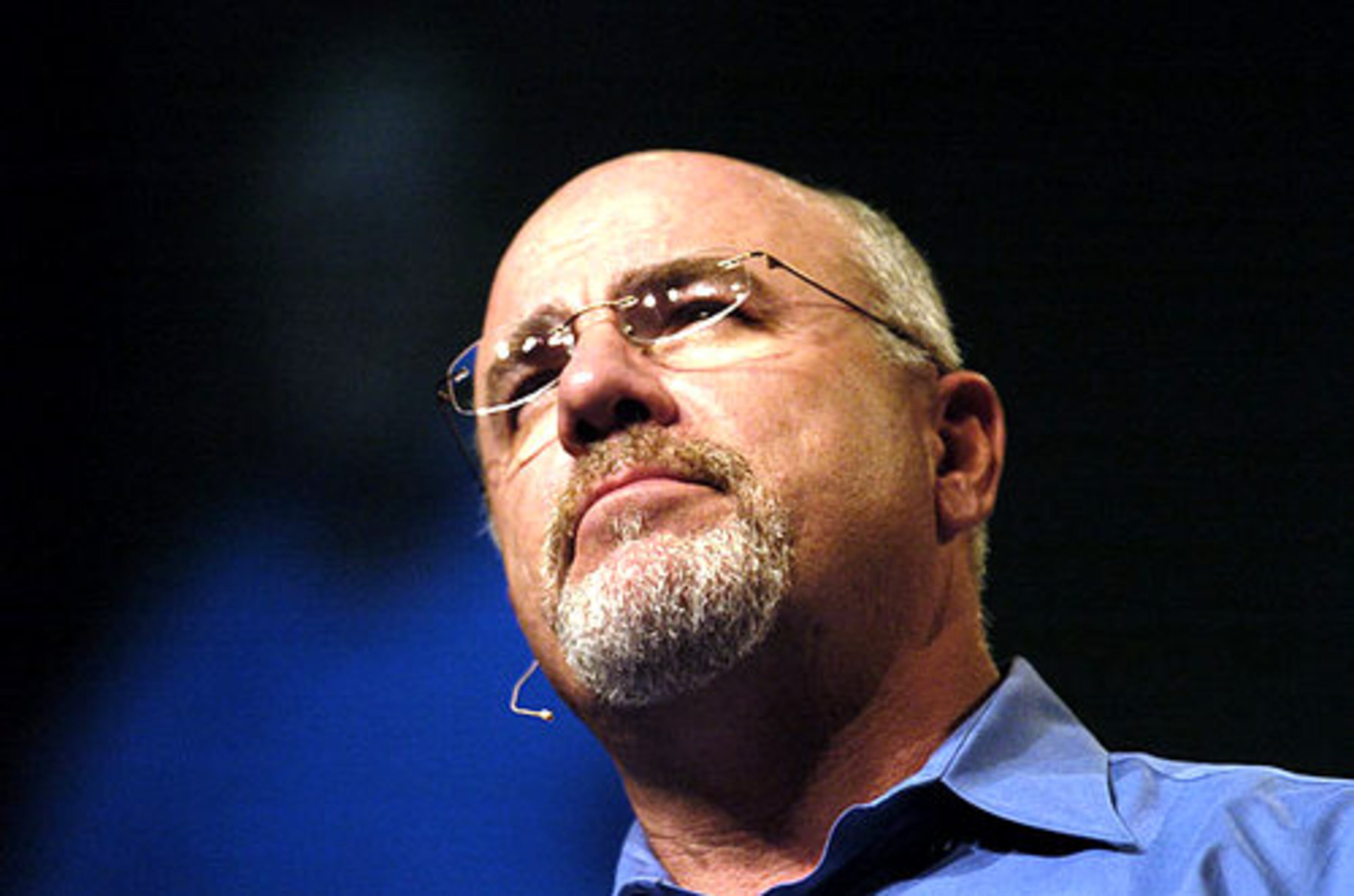 Financial guru Dave Ramsey speaks on stage at the Gwinnett Arena. He is host of "The Dave Ramsey Show."
