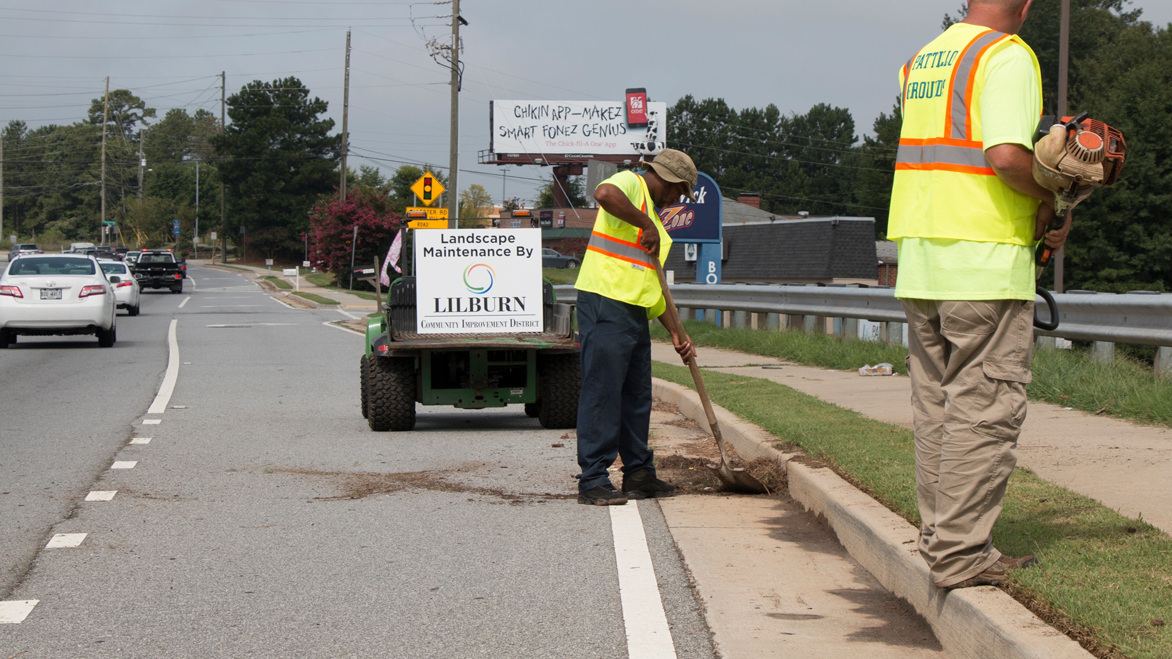 Lilburn CID workers performing landscape maintenance along Lawrenceville Highway. Courtesy Lilburn CID