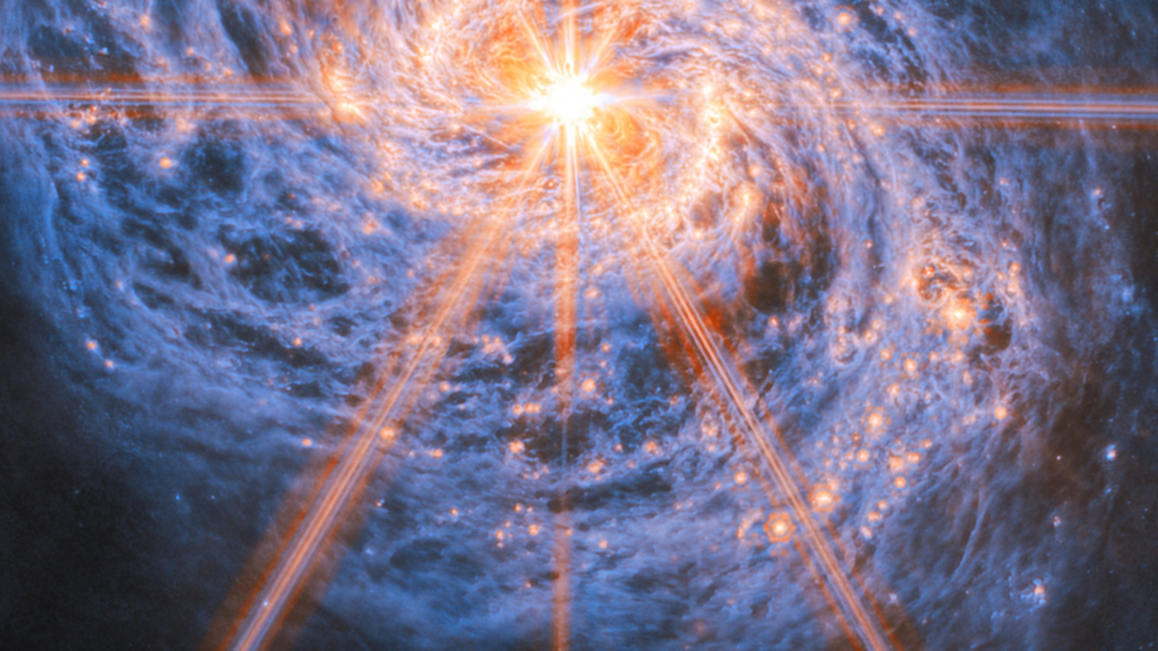 This image provided by NASA/ESA/Webb from the NASA/ESA/CSA James Webb Space Telescope shows Messier 77 (M77), a barred spiral galaxy famous and appreciated among astronomers for its combination of relative proximity and spectacular features to study. (NASA via AP)