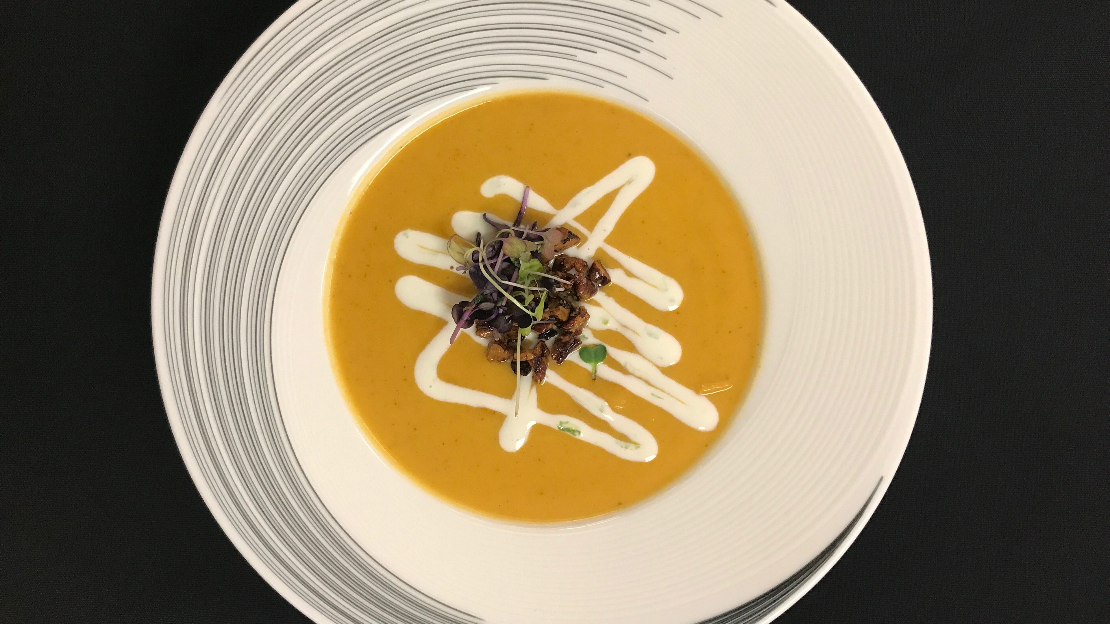 Sweet potato curry, lime cream, spiced pecans, micro greens on the menu at The Whiskey Project