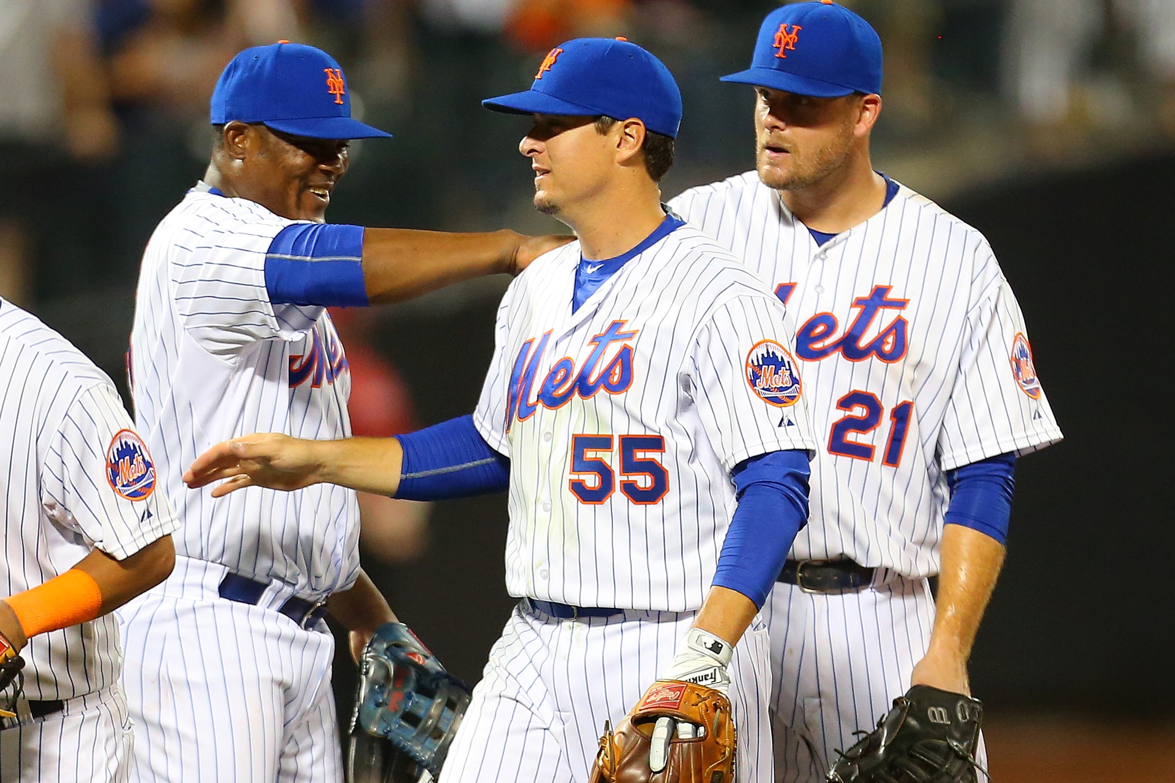 Kelly Johnson #55 of the New York Mets celebrates with teammate Juan Uribe after defeating the Los Angeles Dodgers 15-2 at Citi Field on July 25, 2015 in Flushing neighborhood of the Queens borough of New York City. (Photo by Mike Stobe/Getty Images)