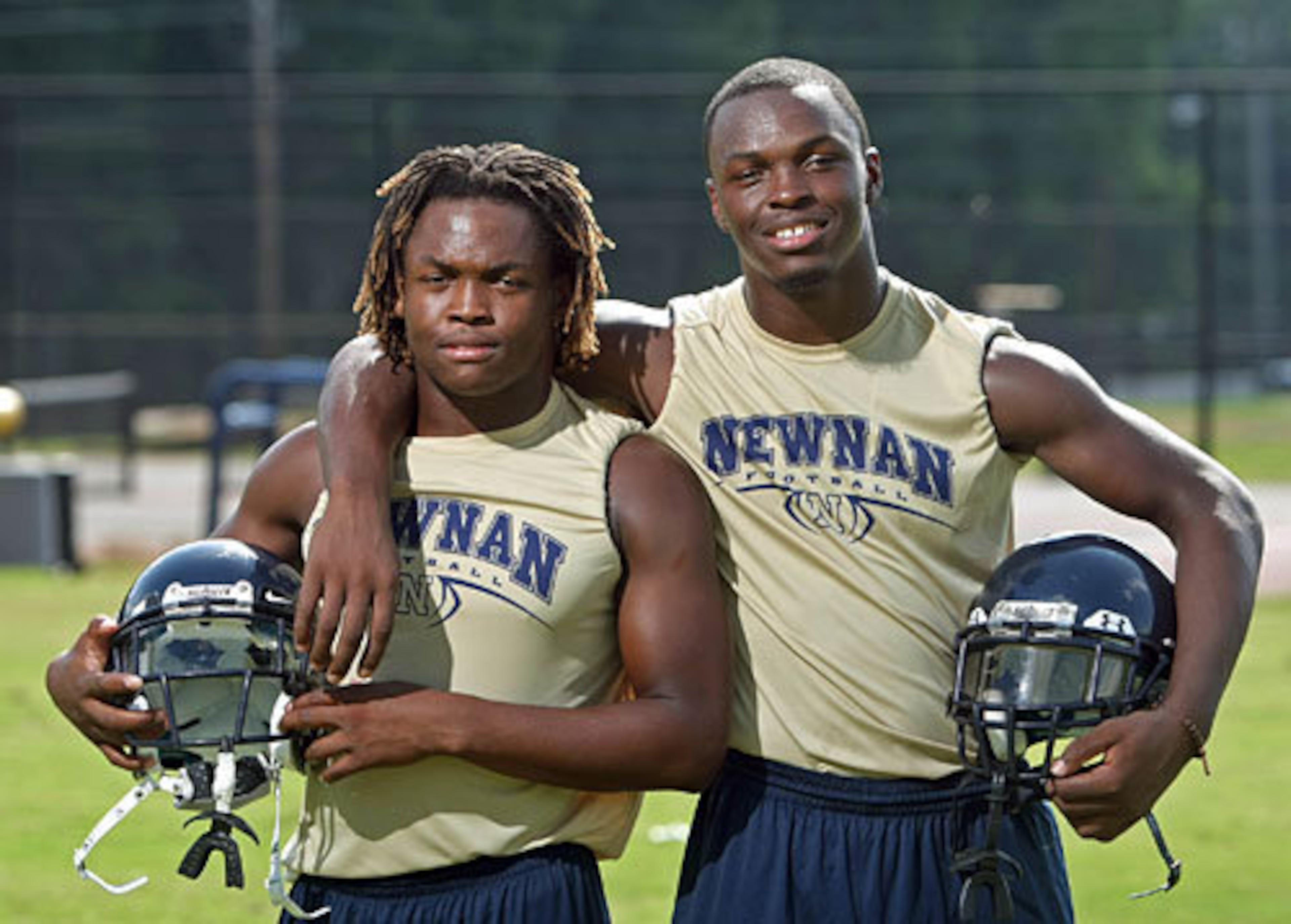 Alexander “Zander” Ogletree (left), shown with his brother Alec Ogletree during their high school playing days, has been coaching high school football since 2015. (Jason Getz/AJC 2009)