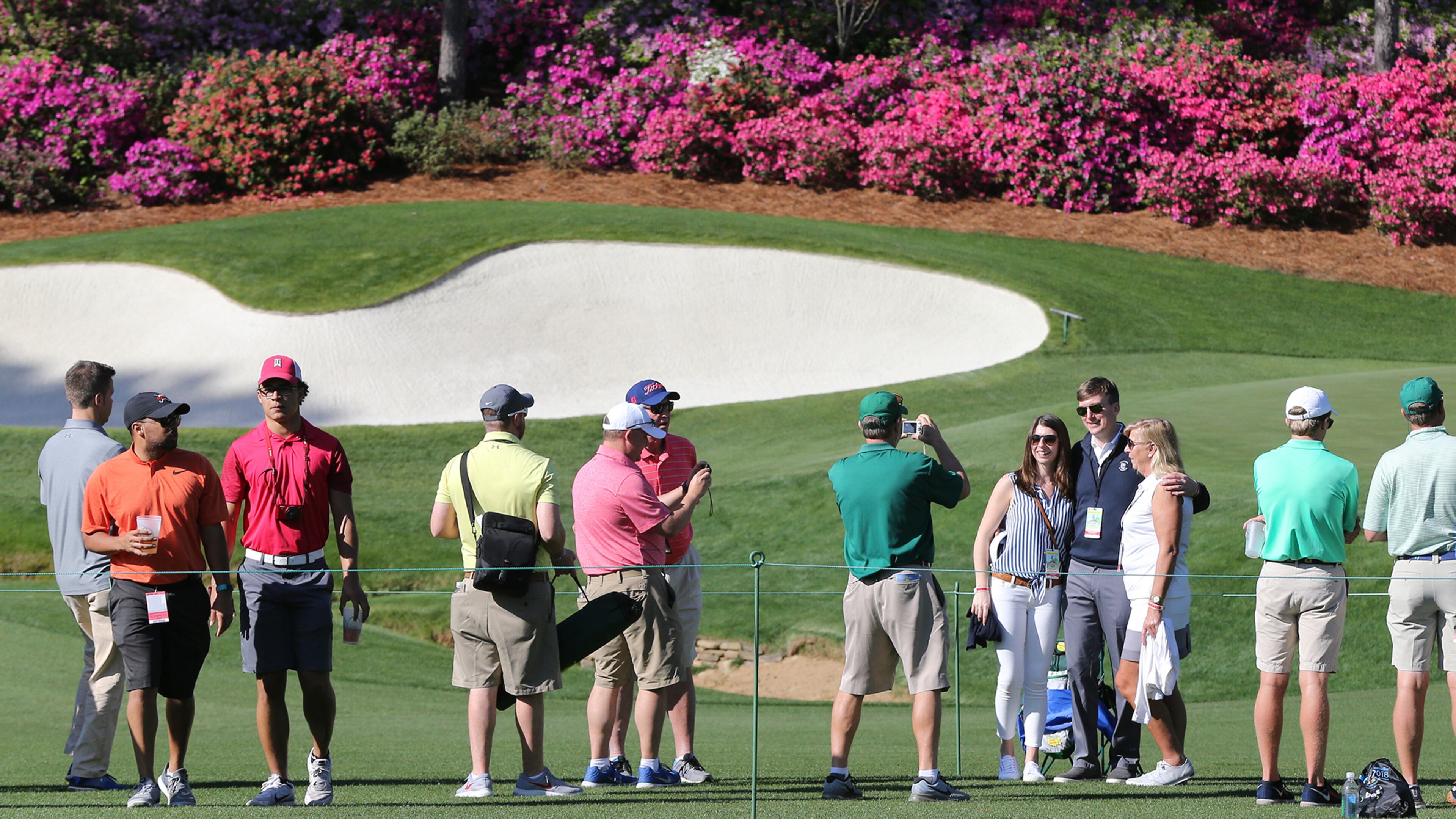 April 2, 2018 Atlanta: Patrons snap photos along the 13th fairway during practice rounds for the Masters at Augusta National Golf Club on Monday, April 2, 2018, in Augusta. Curtis Compton/ccompton@ajc.com