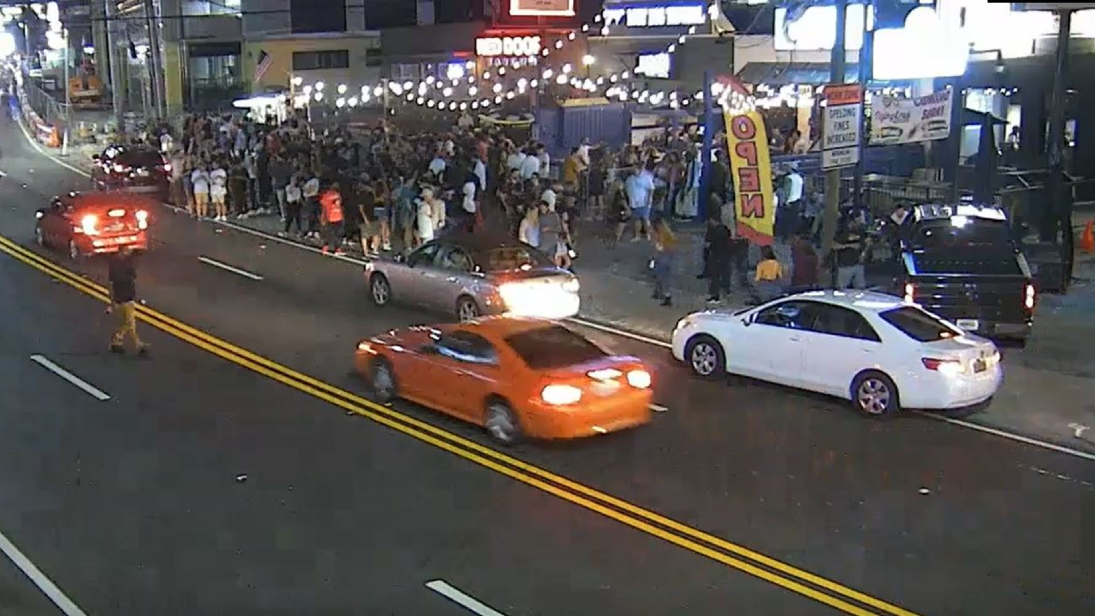 The woman was walking along Roswell Road in the area of Red Door Tavern and talking with several people when the group heard two gunshots, according to police. She then realized she was shot in the arm.