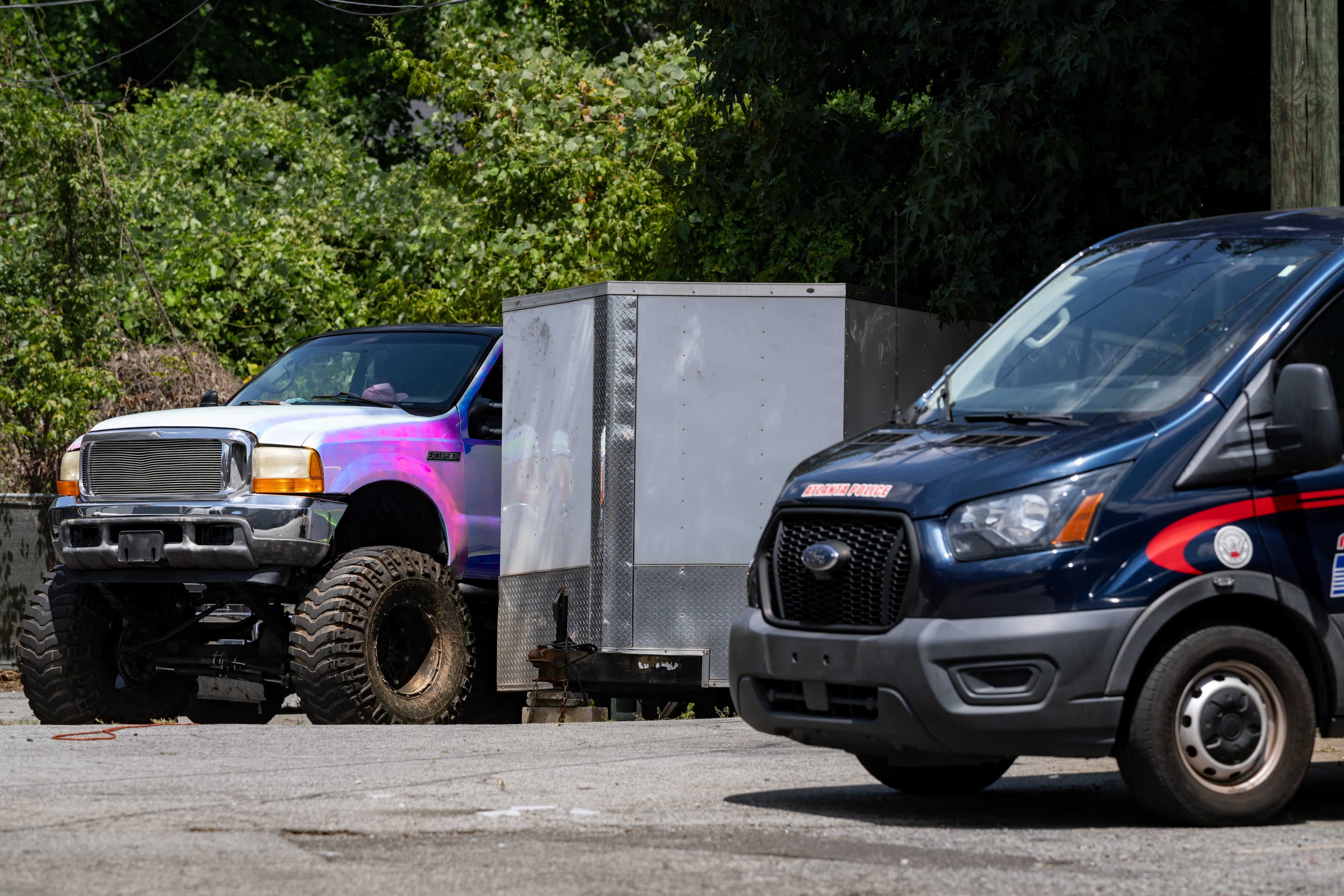 Two kidnapped children were recovered from inside a tow trailer on the property of the Gateway South apartment complex on Monday, Aug. 17, 2026. (Ben Hendren for the AJC)
