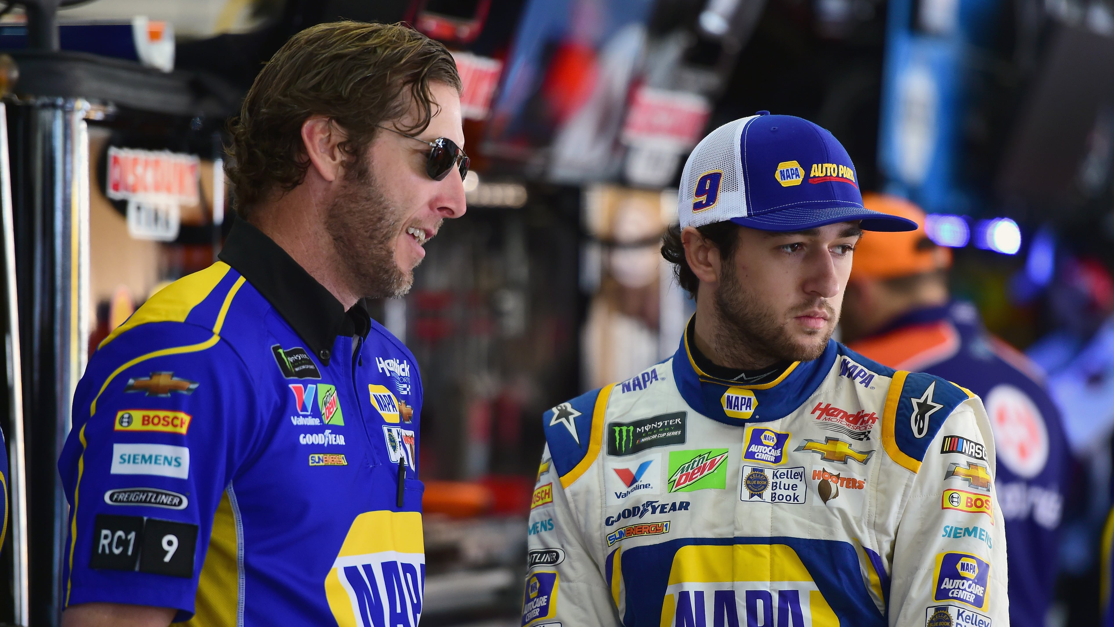 Chase Elliott (R) confers with crew chief Alan Gustafson in the garage area at AMS during practice for Sunday's Folds of Honor QuikTrip 500. (Jared C. Tilton/Getty Images)
