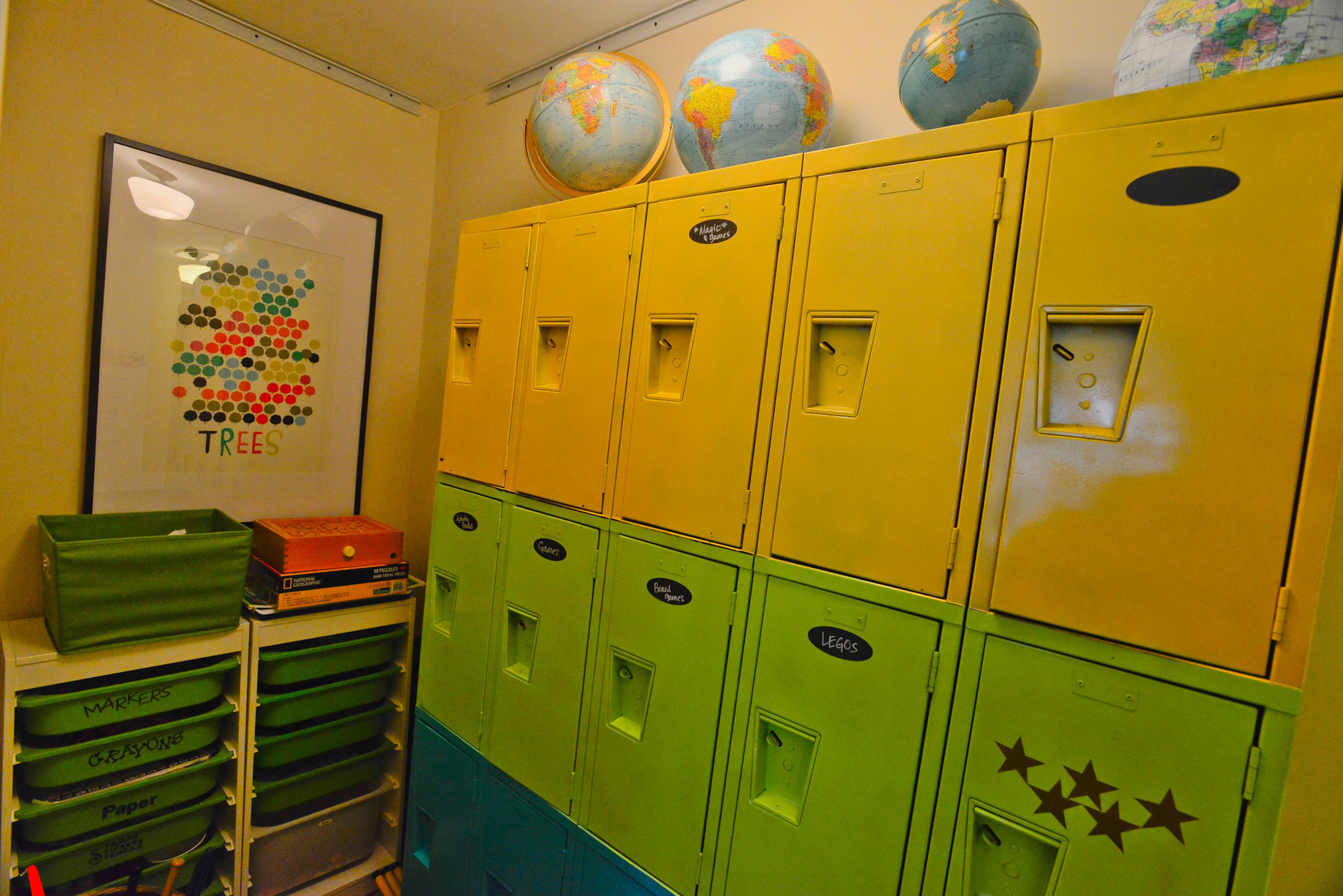 Homeowner Karen Cooper found these lockers at a Habitat for Humanity ReStore, repainted them in bright colors and placed them in a hall near her children's rooms.