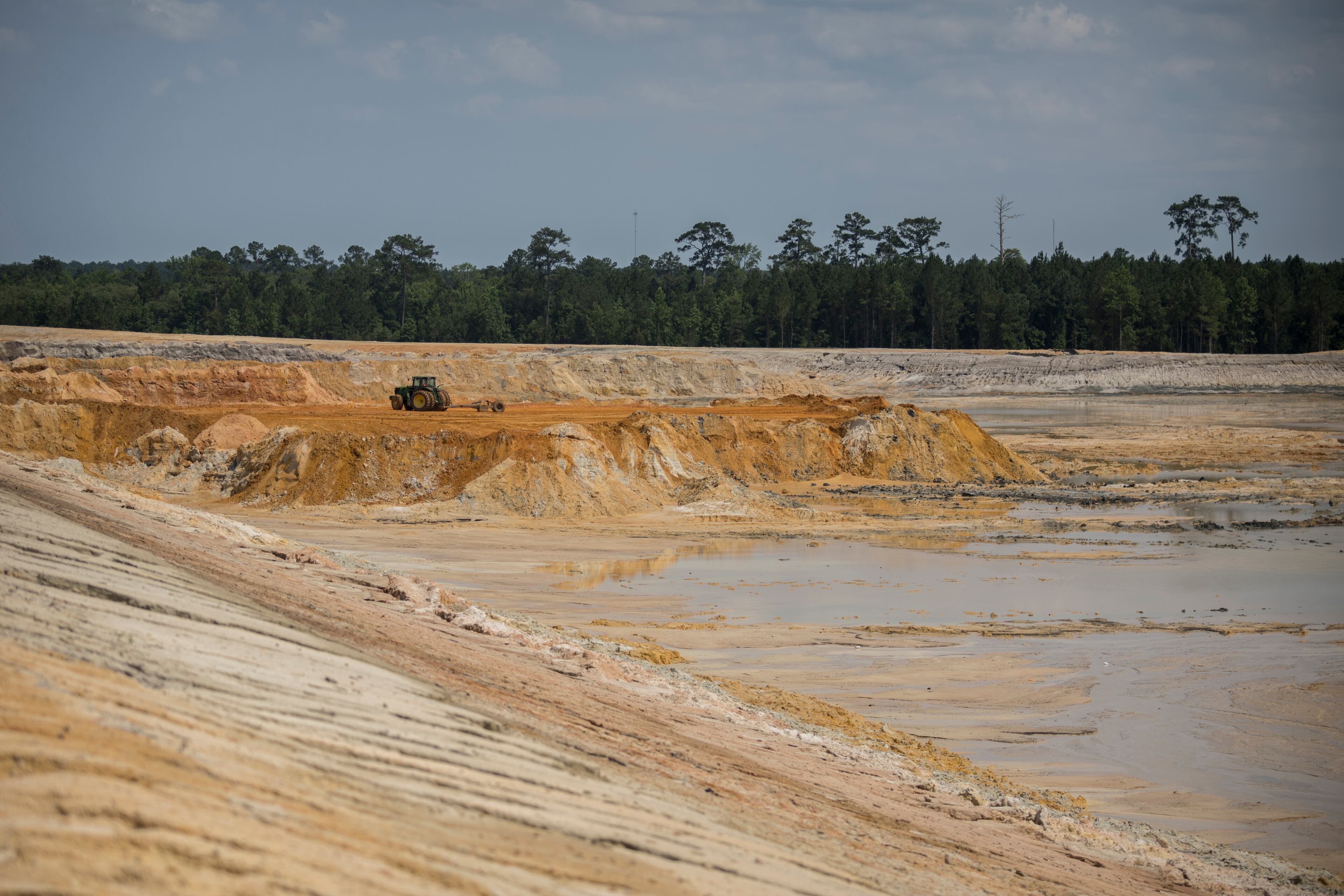 ELLABELL, GA. - JUNE 5, 2023: A bulldozer works a large reservoir at the construction site of the Hyundai Metaplant, Monday, June 5, 2023, in Ellabell, Ga. (AJC Photo/Stephen B. Morton)