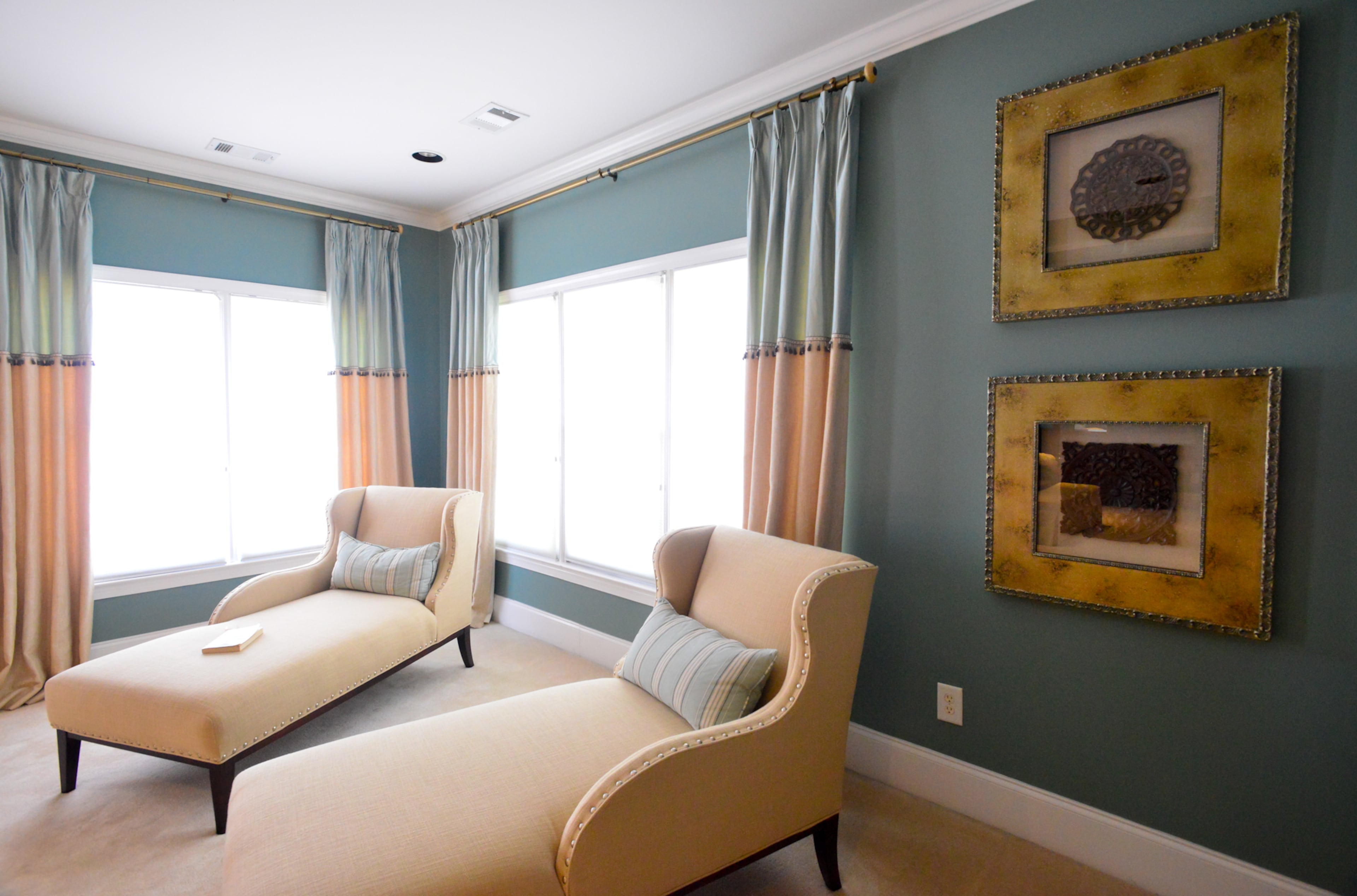 Billy and Shawn Evans Mitchell's master bedroom include custom-upholstered chaise lounges by Sam Moore, two-tone window treatments designed by Barbara Elliott and Jennifer Ward Woods of Decorating Den Interiors and created by Atlanta's Finest Design, using fabric from Eastern Accents. The artwork is framed Aged Rosette prints by Malanta Knowles.