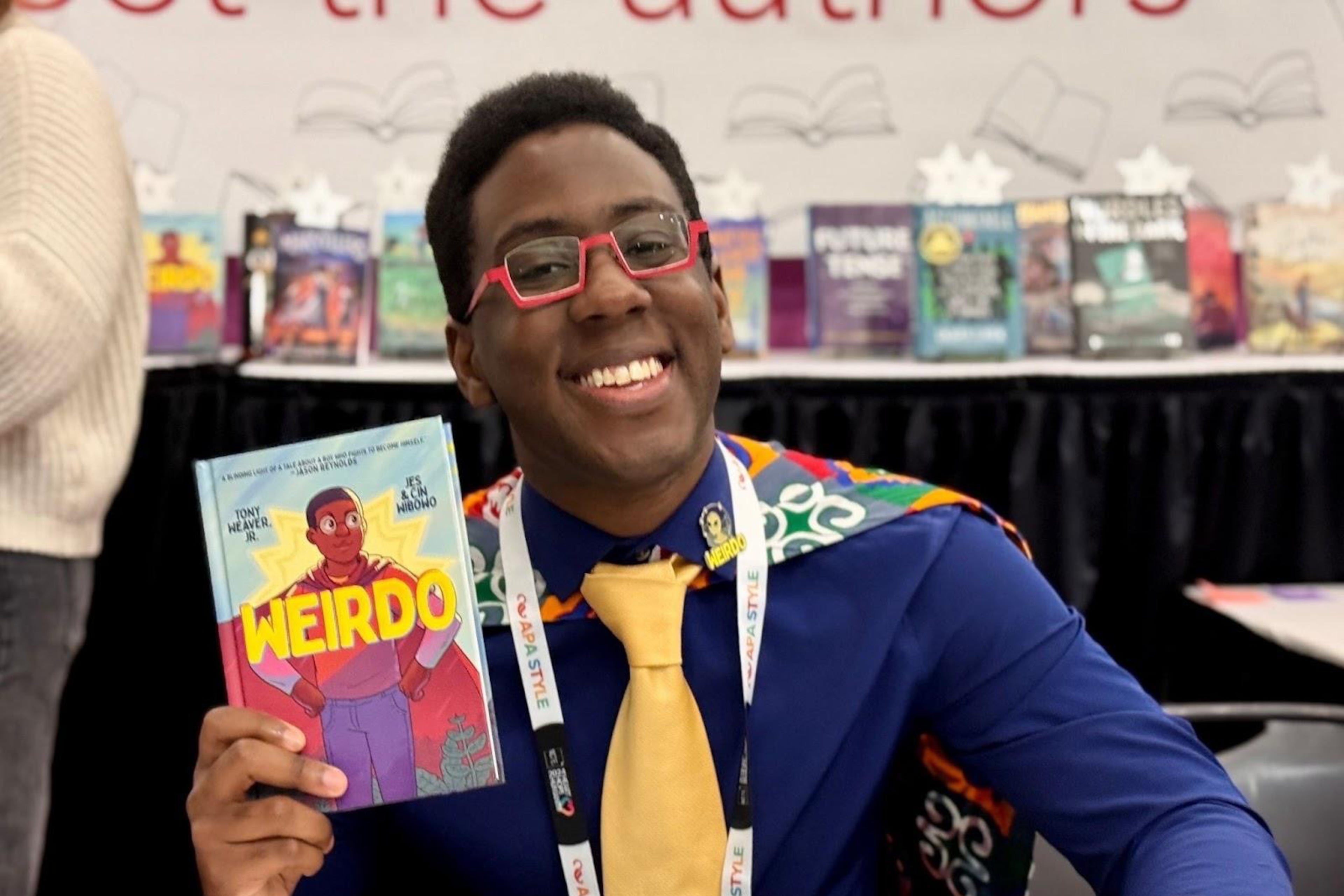 Nerds for Literacy Founder Tony Weaver Jr. poses with his graphic memoir, "Weirdo." (Courtesy of Tony Weaver Jr.)
