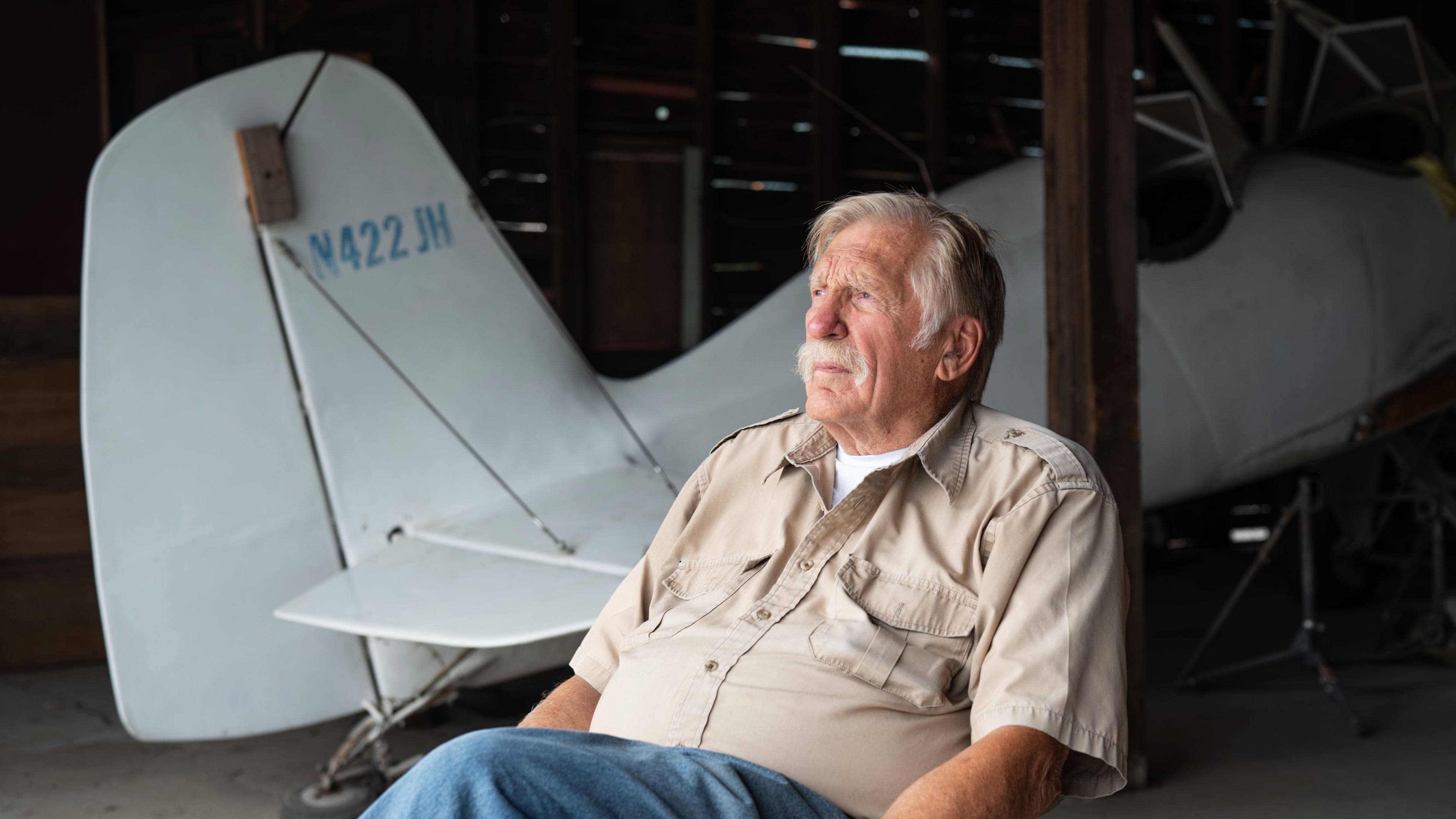 In this Aug. 2025 photo provided by James Wilson, Ken Jouppi sits in a hanger at the Shoshone County Airport in Shoshone County, Idaho. (James Wilson via AP)