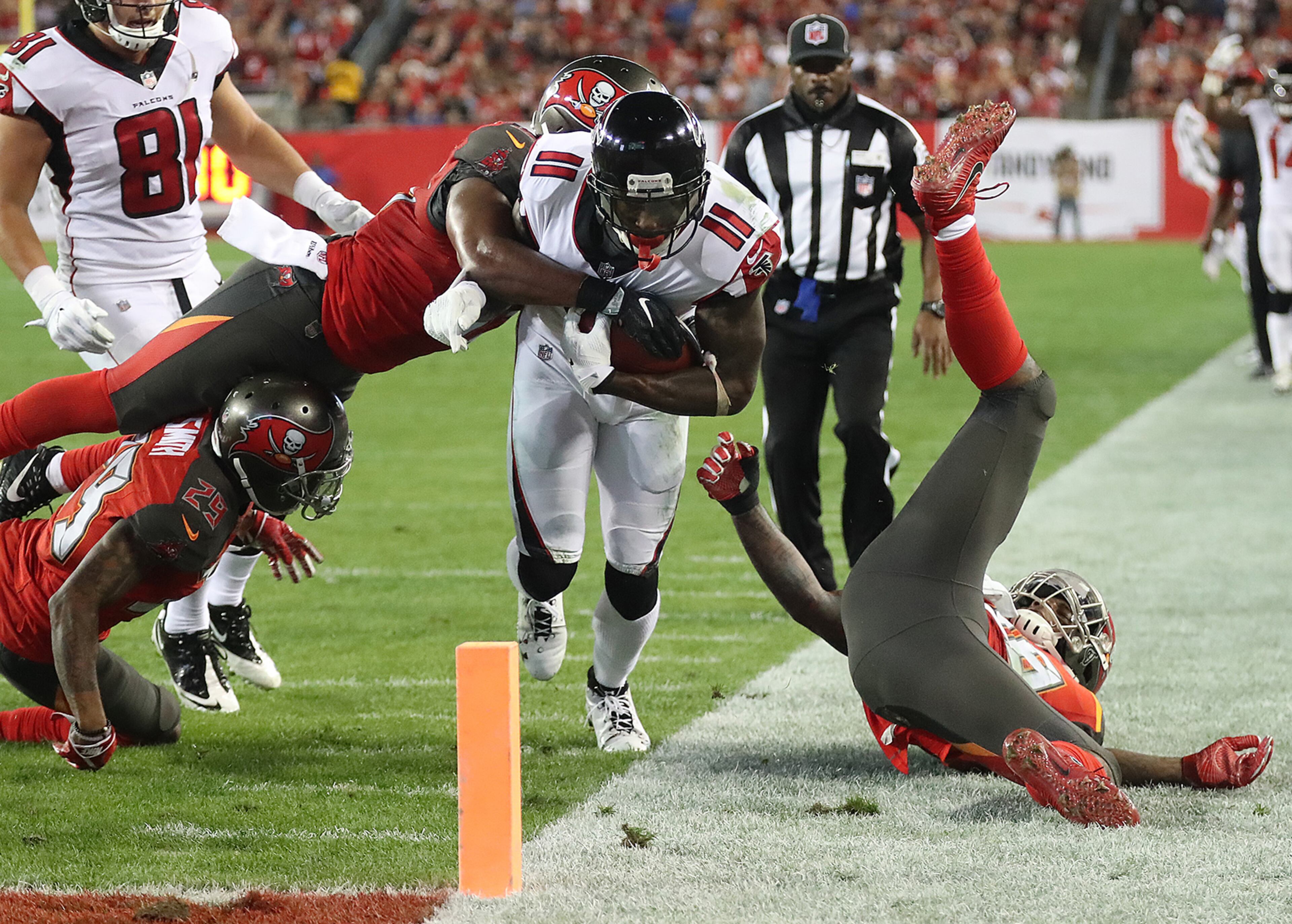 December 18, 2017 Tampa: Falcons wide receiver Julio Jones is stopped just short of the endzone by three Buccaneers defenders with linebacker Adarius Glanton making the tackle during the second quarter in a NFL football game on Monday, December 18, 2017, in Tampa. Curtis Compton/ccompton@ajc.com