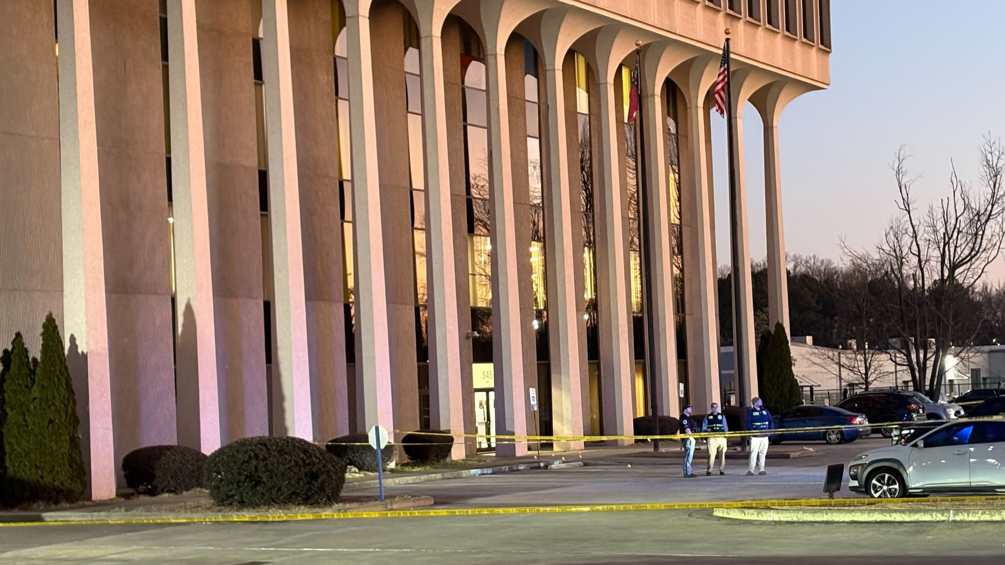 The front parking lot of Cobb County police headquarters was taped off and GBI officials were at the scene. (Alexis Stevens / AJC)