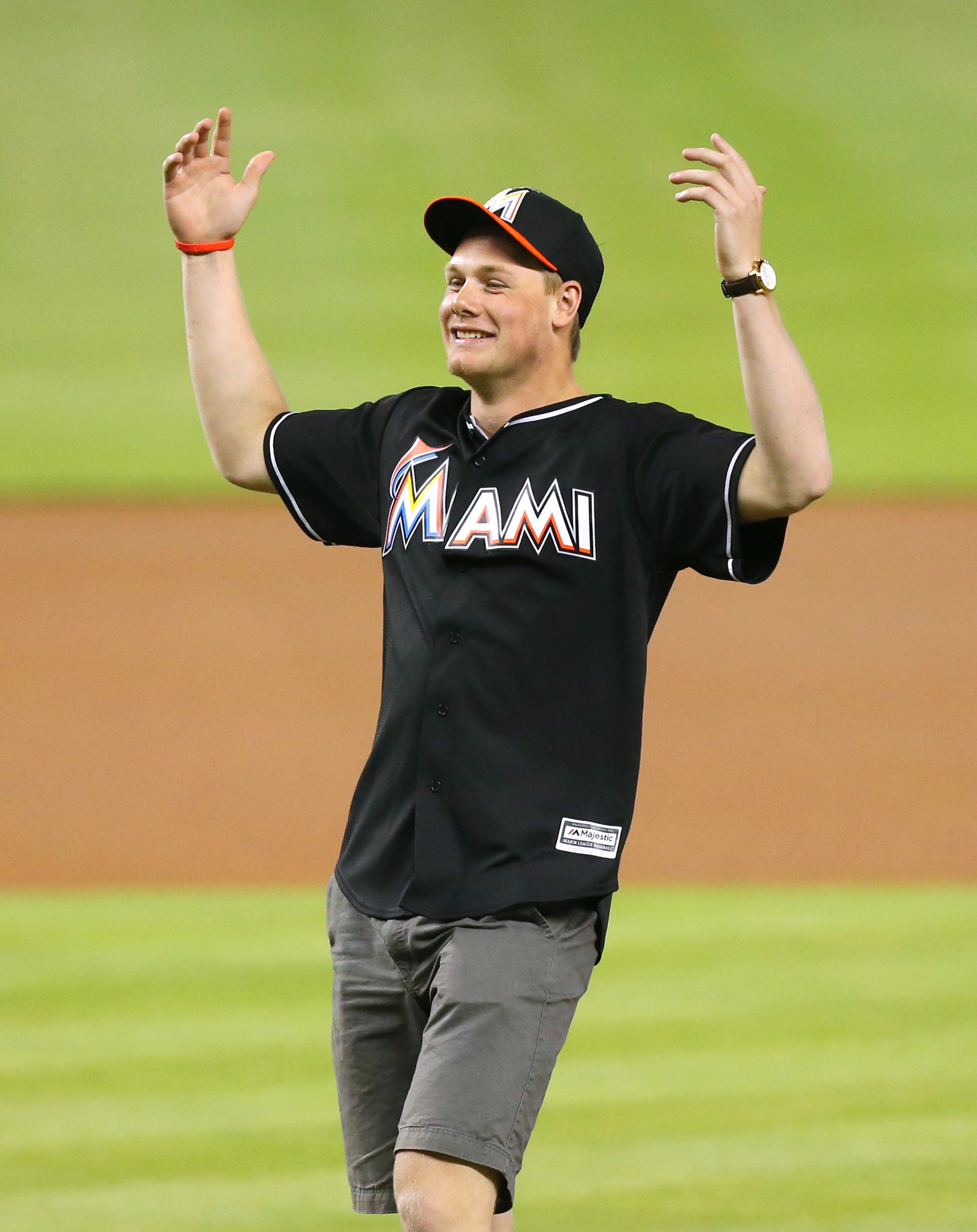 Florida Panthers draft pick Lawson Crouse reacts after throws the ceremonial first pitch before the Miami Marlins play host to the San Francisco Giants at Marlins Park in Miami on Wednesday, July 1, 2015. The Marlins won, 6-5. (David Santiago/El Nuevo Herald/TNS)