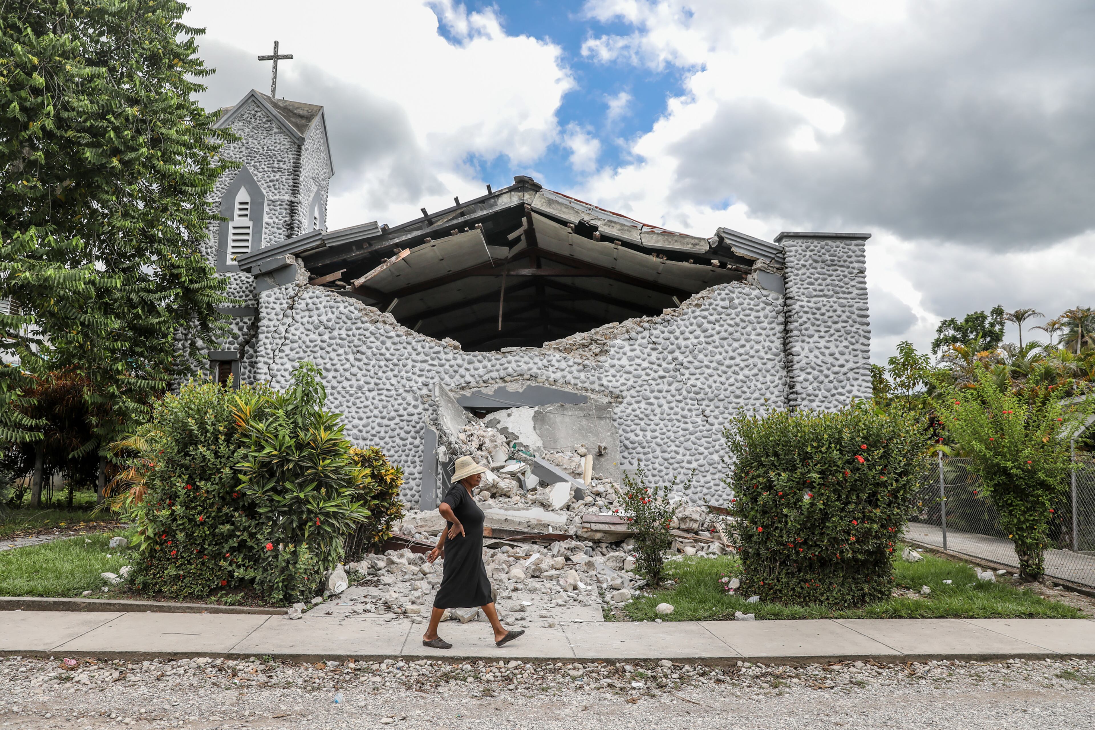 A church damaged by an earthquake in Camp-Perrin, Haiti, on Sunday, Aug, 15, 2021. Haitians struggled with a lack of basic supplies, including food and medical care, in the aftermath of a magnitude 7.2 earthquake on Saturday that snapped water lines, blocked roaCayes Airportds, flattened grocery stores and damaged hospitals on the country’s southwestern peninsula. (Valerie Baeriswyl/The New York Times)