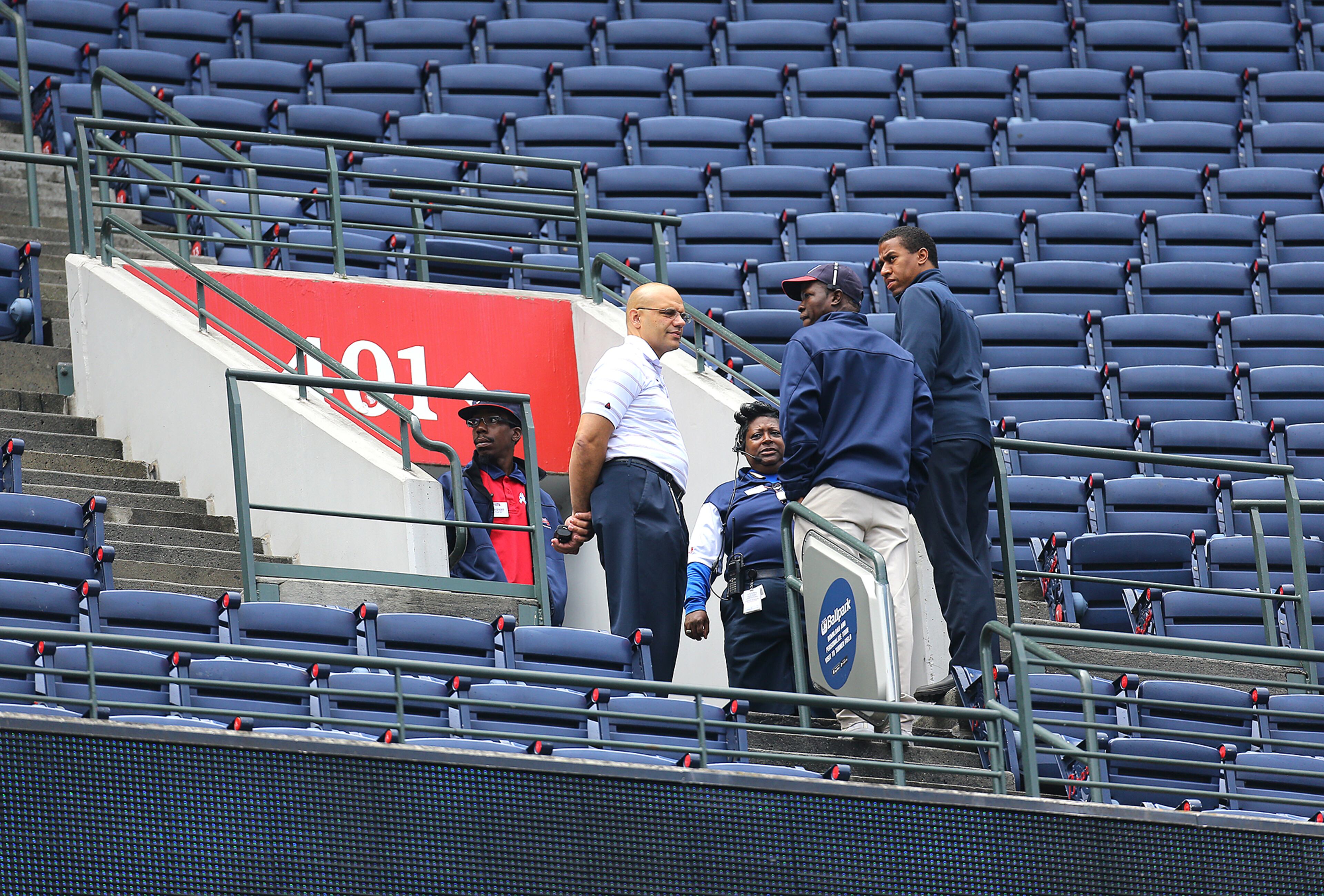 083015 ATLANTA: Braves employees stand at the portal of section 401 near the location where baseball fan Gregory Murrey, 60, Alpharetta, fell at least 40 feet from the top deck to his death during yesterday's game between the Braves and Yankees as they prepare for today’s game 3 between the teams on Sunday, August 30, 2015, in Atlanta. Curtis Compton / ccompton@ajc.com