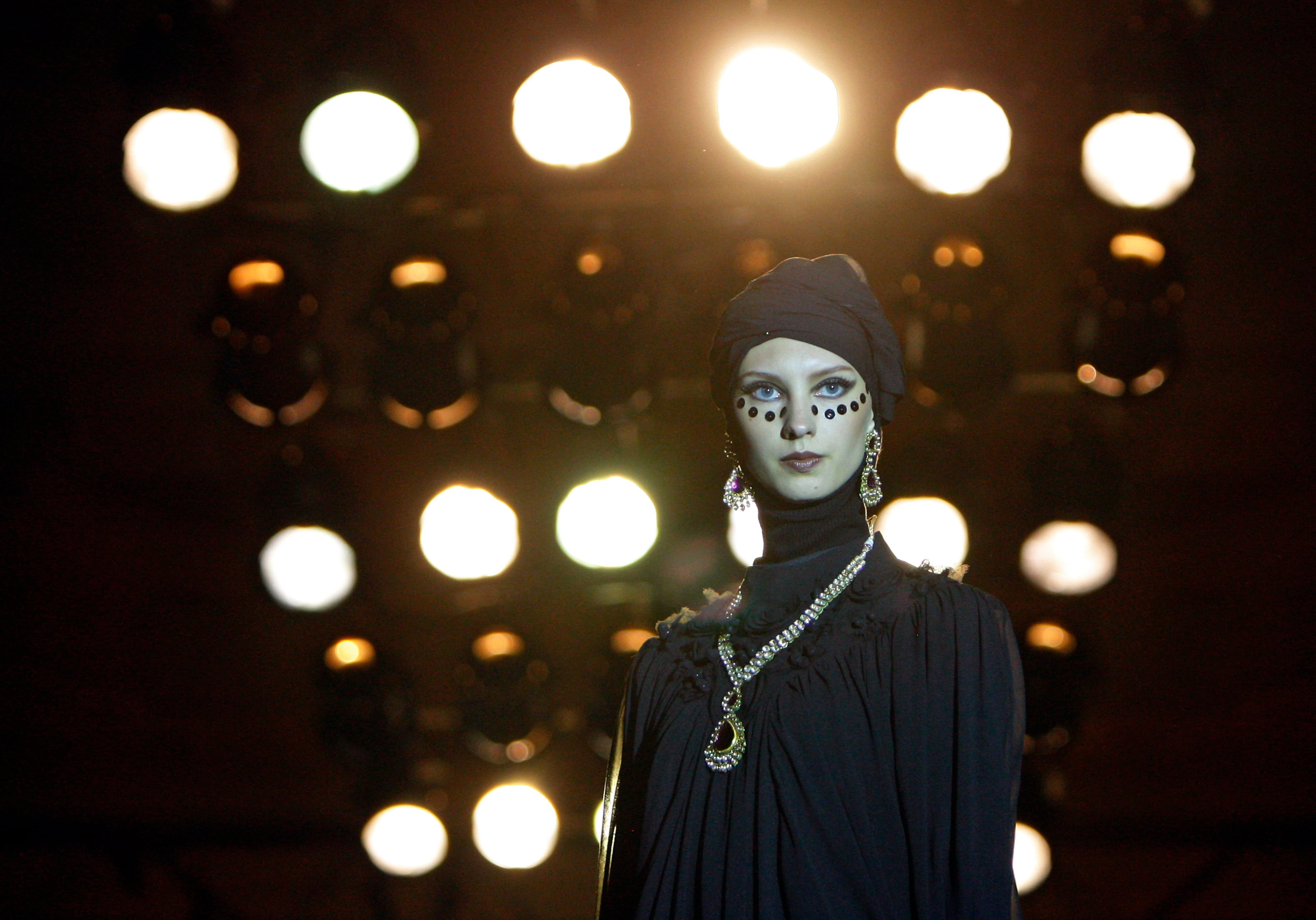 A model presents earrings and a necklace by Jaipore Jewels from Singapore during the Islamic Fashion Festival in Kuala Lumpur, Malaysia, Monday, Nov. 5, 2012.