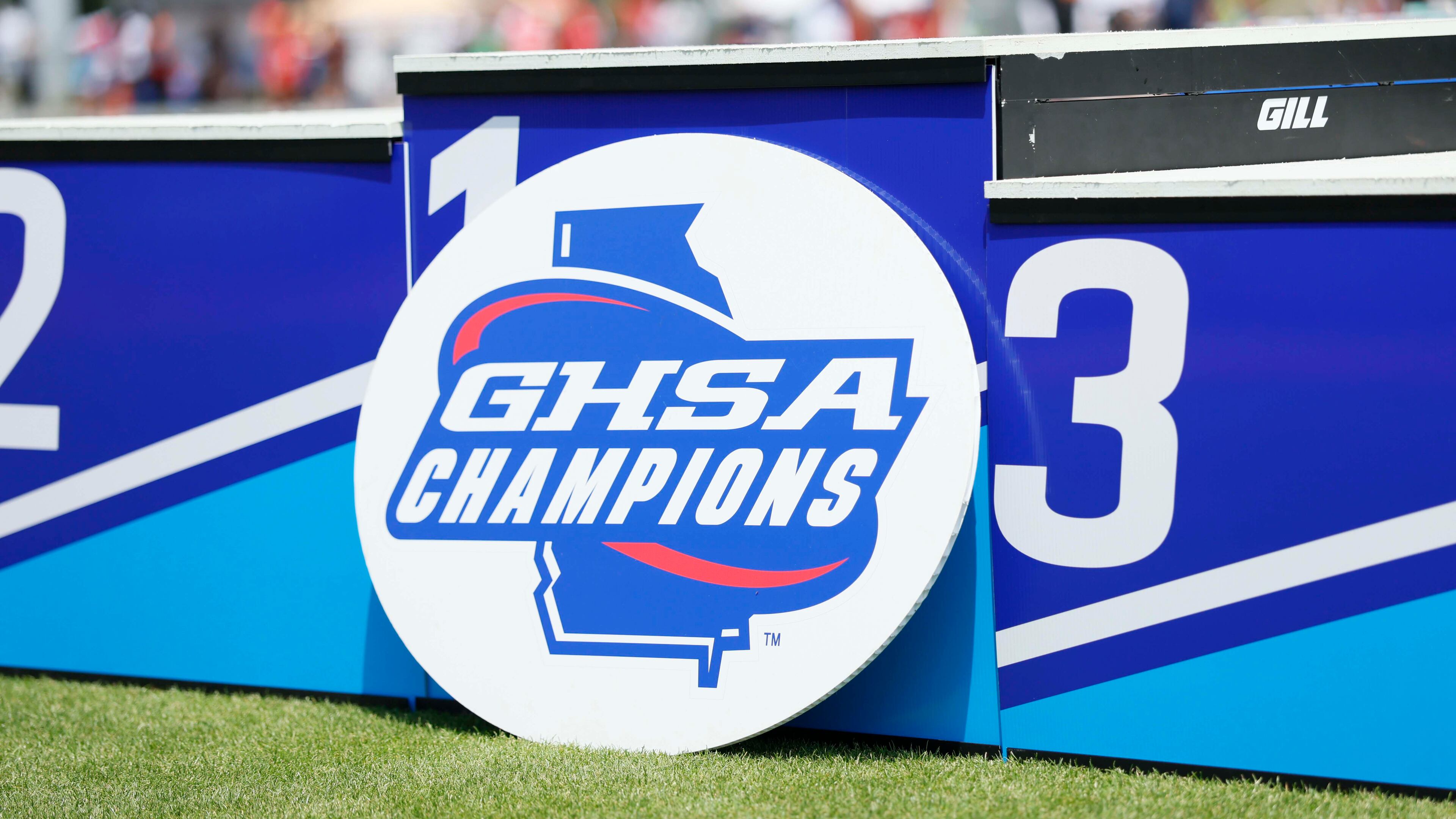 A GHSA logo is seen on the athletes’ podium during the Boys 1600-meter Run 1A Division 2 at the GHSA track and field state championships at UGA Spec Towns Track on Monday, May 11, 2026, in Athens. (Miguel Martinez/AJC)