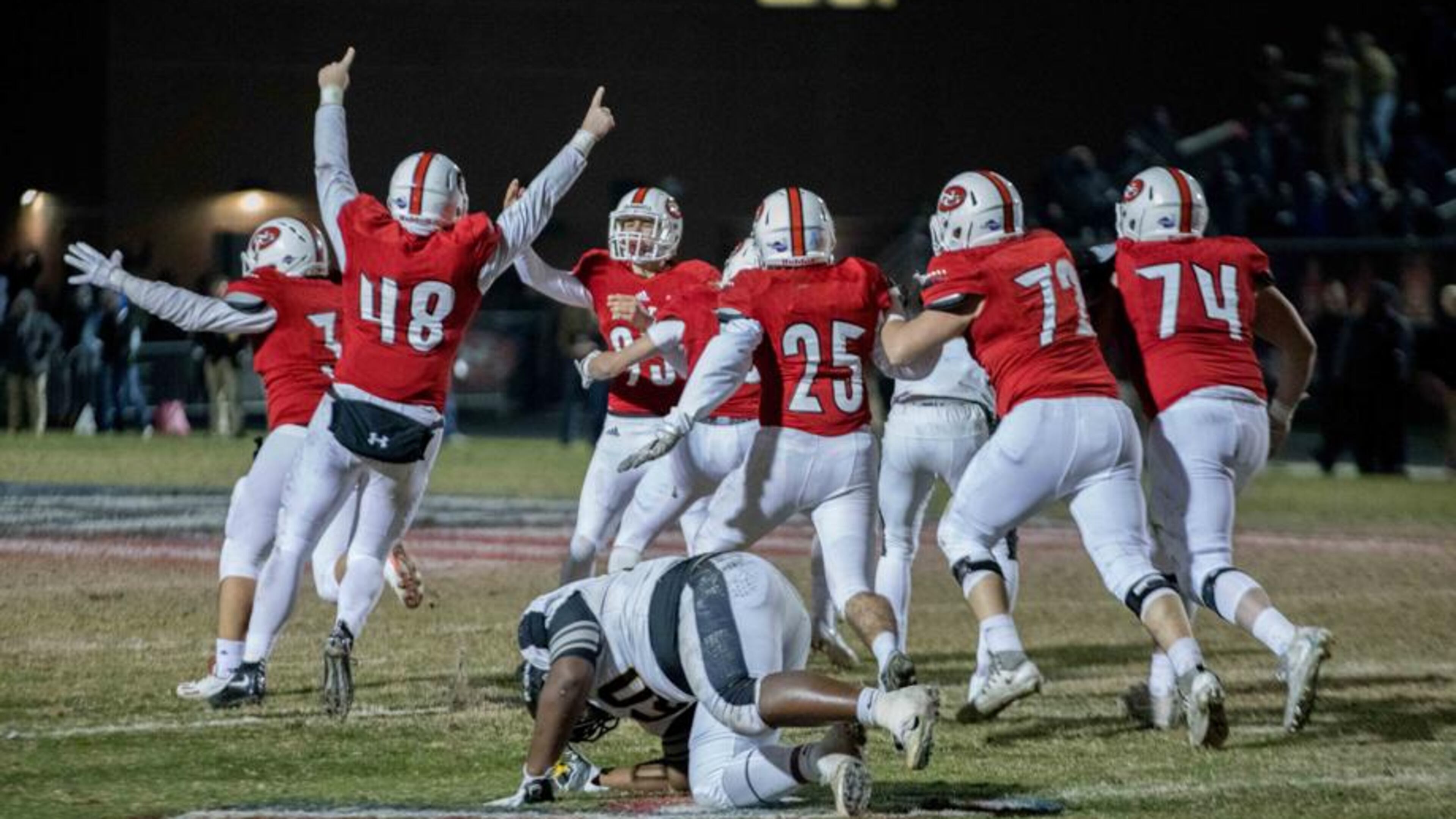 North Gwinnett High School players celebrate after kicker Cameron Clark (93) kicked the game winning field goal against Colquitt High School during a Class AAAAAAA football championship game, Friday, Dec. 15, 2017, in Suwanee.