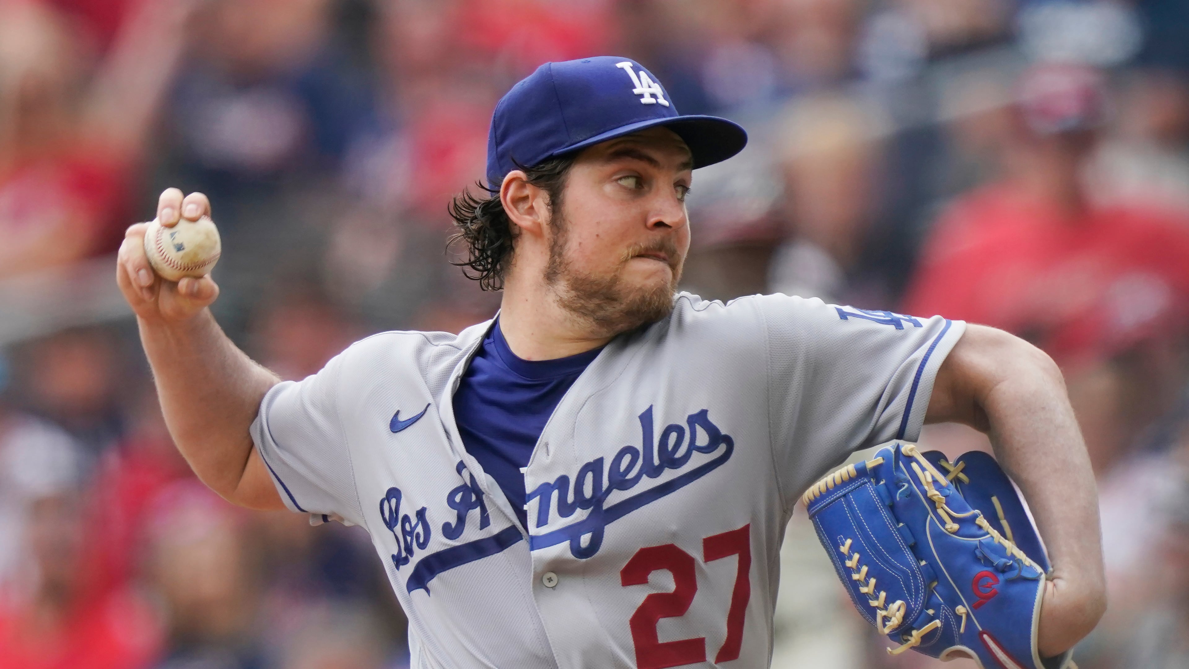 FILE - Los Angeles Dodgers starting pitcher Trevor Bauer (27) delivers in the first inning of a baseball game against the Atlanta Braves, Sunday, June 6, 2021, in Atlanta. (AP Photo/Brynn Anderson, File)