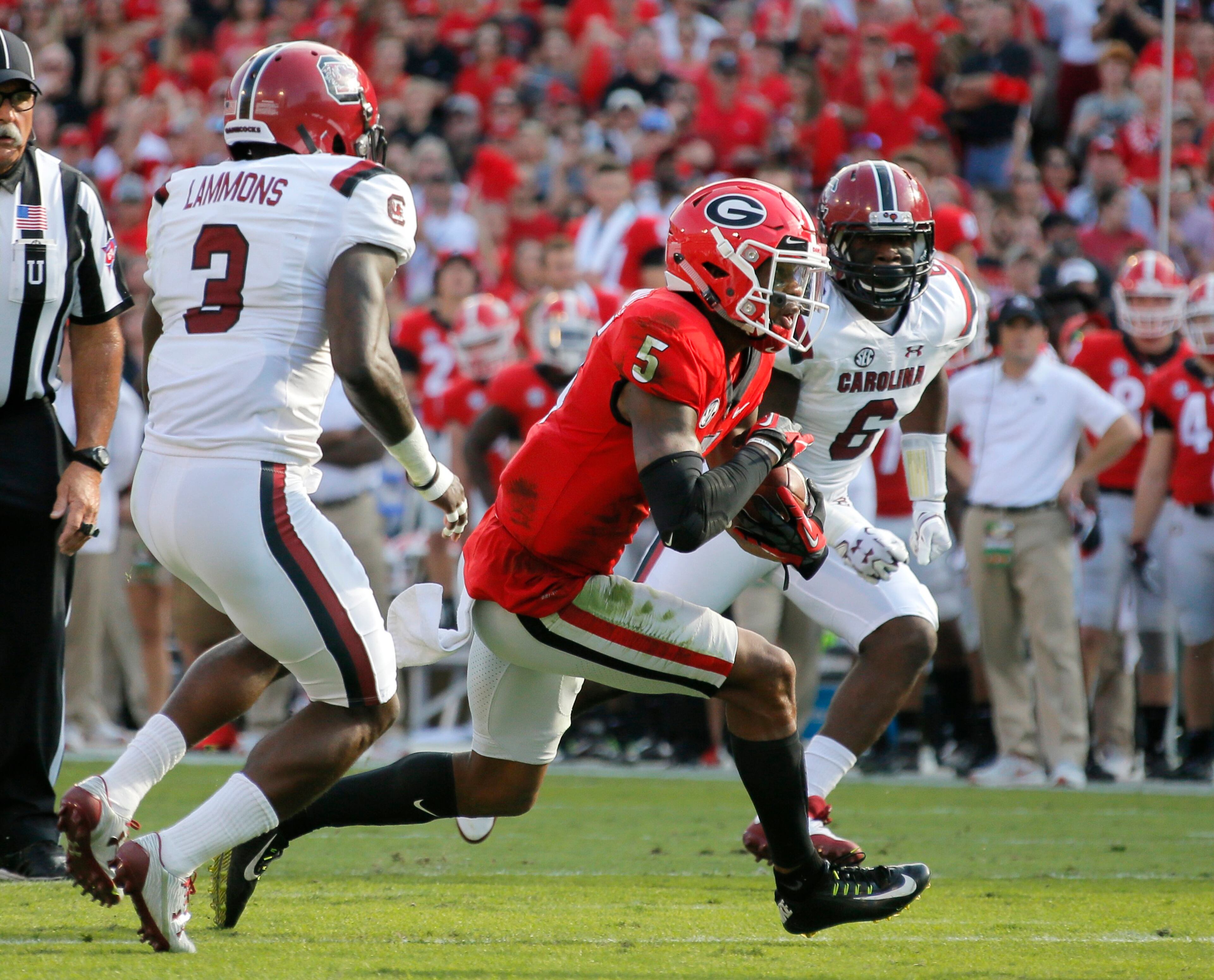 11/4/17 - Athens - Georgia Bulldogs wide receiver Terry Godwin (5) runs for a big gain, but fumbled at the end of the run. Gamecocks recovered. NCAA football game between the University of Georgia Bulldogs and the University of South Carolina Gamecocks BOB ANDRES /BANDRES@AJC.COM