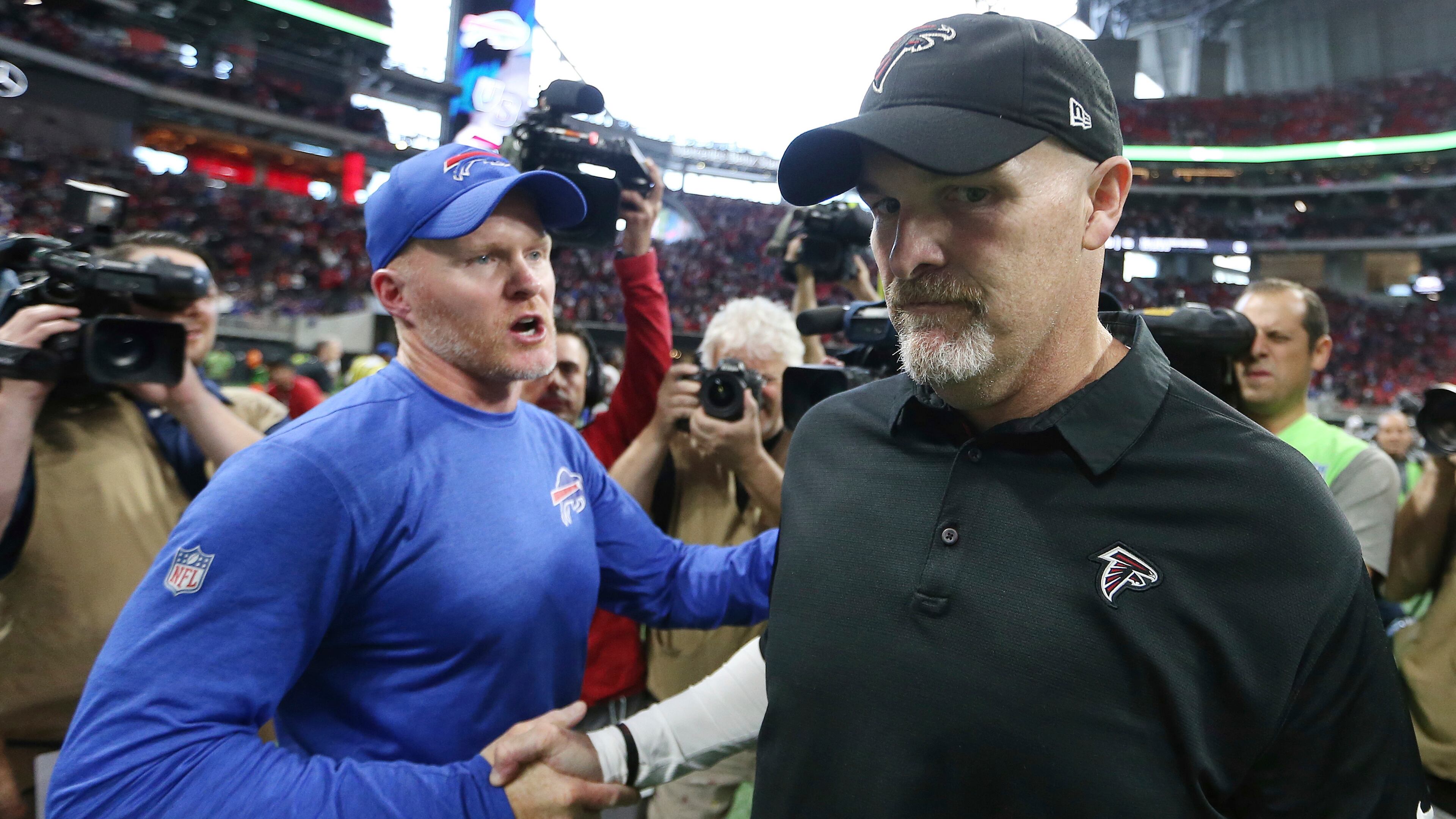 Buffalo Bills head coach Sean McDermott speaks with Atlanta Falcons head coach Dan Quinn after an NFL football game, Sunday, Oct. 1, 2017, in Atlanta. The Buffalo Bills won 23-17. (AP Photo/John Bazemore)