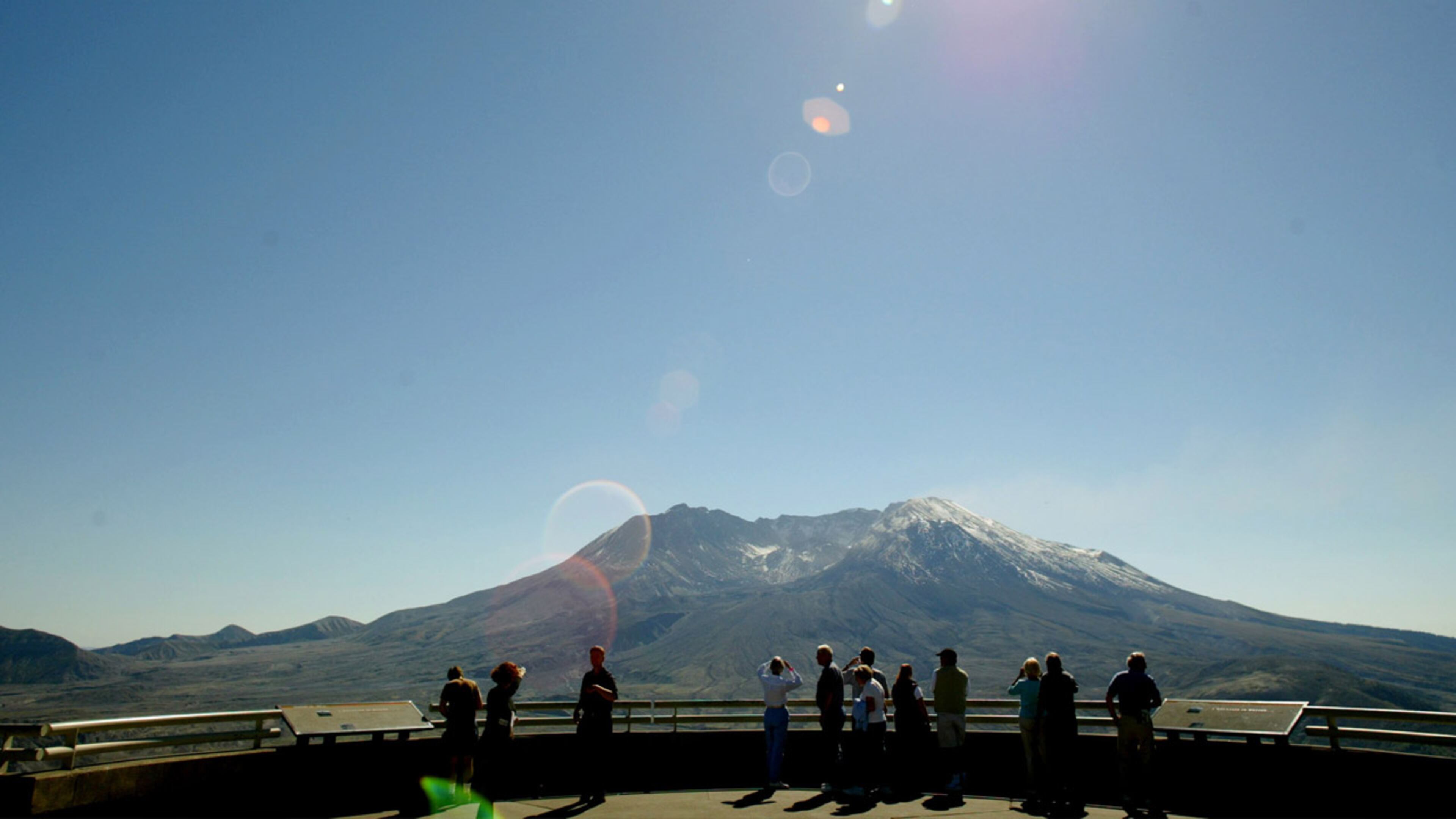Visitors take in the view of Mt. St. Helens from the Johnston Ridge Observatory September 27, 2004.