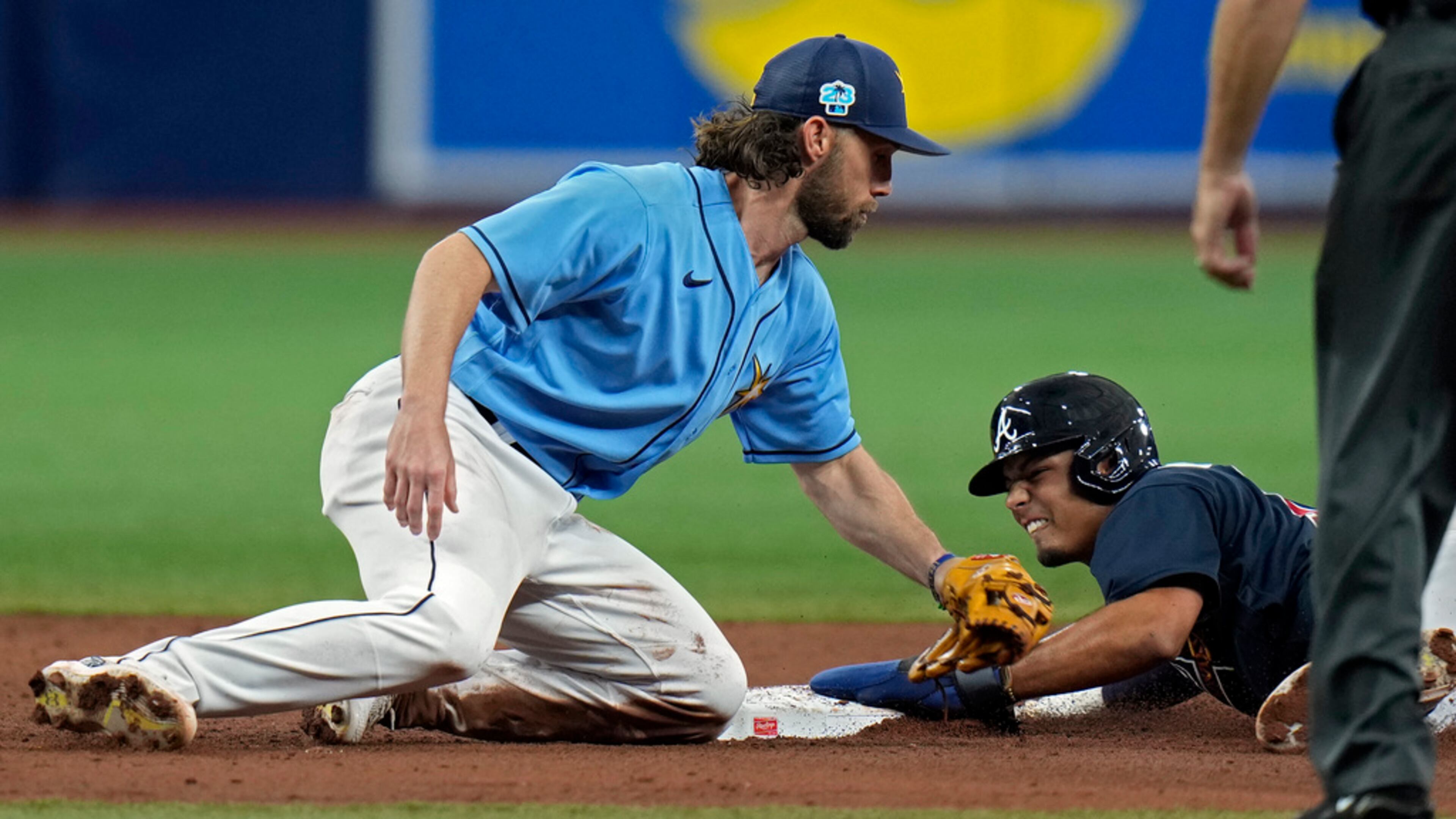 Tampa Bay Rays second baseman Charlie Culberson, left, is late with the tag as Atlanta Braves' Vaughn Grissom steals second base during the sixth inning of a spring training baseball game Friday, March 10, 2023, in St. Petersburg, Fla. (AP Photo/Chris O'Meara)