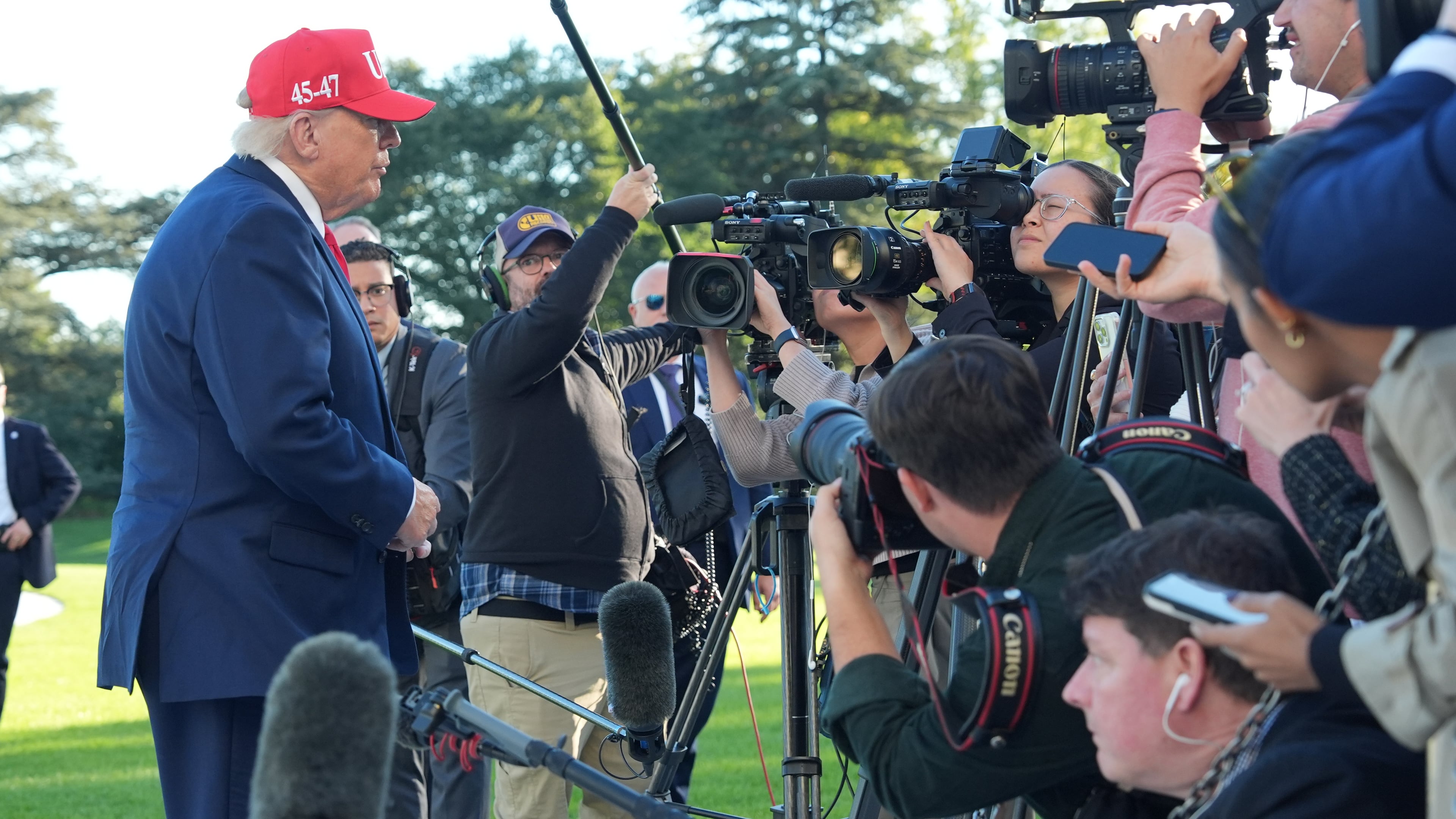 President Donald Trump speaks with reporters after arriving on Marine One from the South Lawn of the White House, Tuesday, Oct. 6, 2026, in Washington. (AP Photo/Alex Brandon)