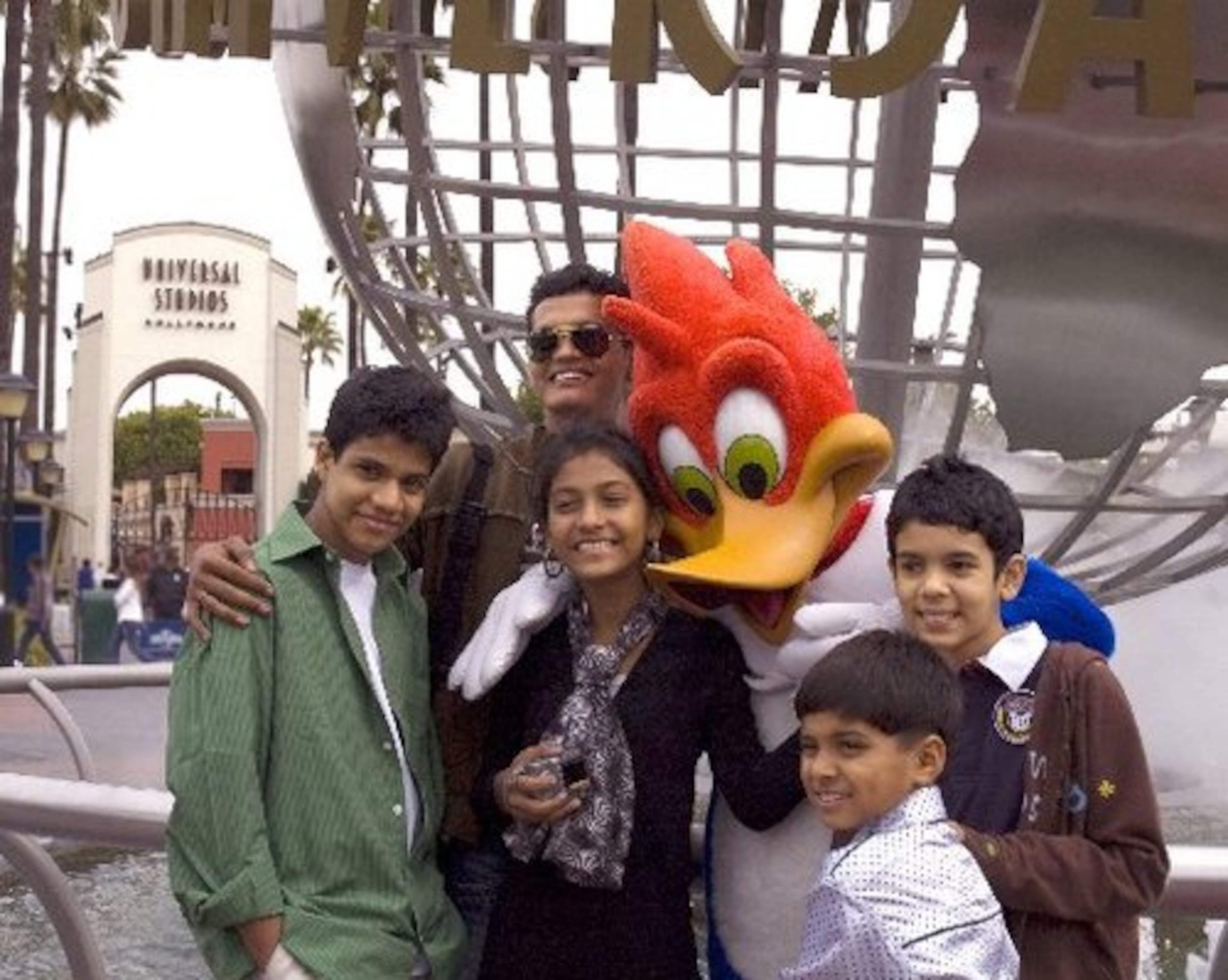 Upon arriving in the United States, the kids went to Universal Studios, where they posed for a photo with Woody Woodpecker on Feb. 21.