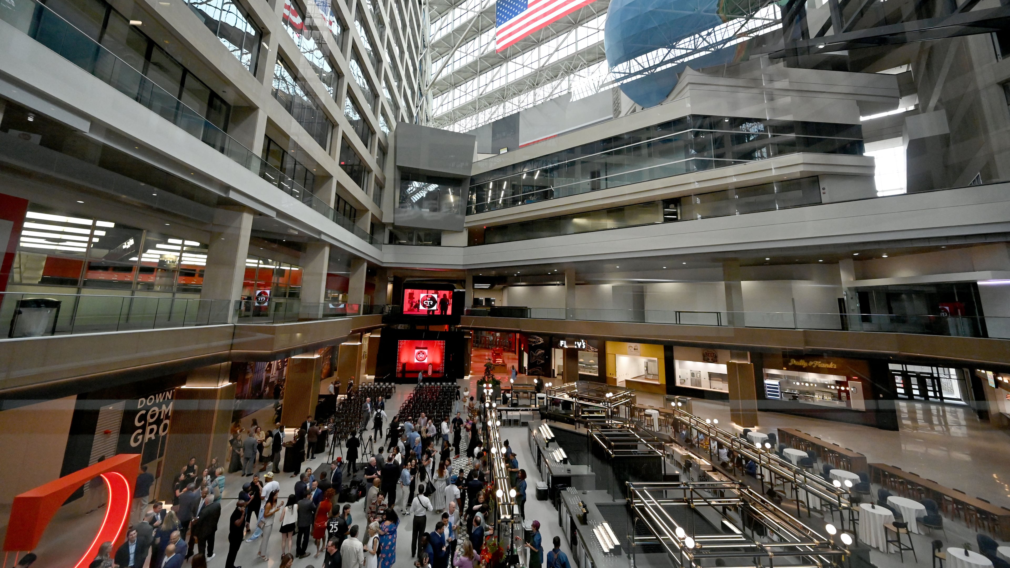 Guests mingle ahead of an unveiling event at The CTR, the former CNN Center, on Wednesday, May 20, 2026, in Atlanta. The former CNN Center in downtown Atlanta has been rebranded and unveiled as The CTR (stylized as "The Center"). CP Group, the property's owners, are transforming the iconic 1.2-million-square-foot complex into a massive mixed-use hub featuring a revamped food hall, experiential entertainment, and public art. (Hyosub Shin/AJC)