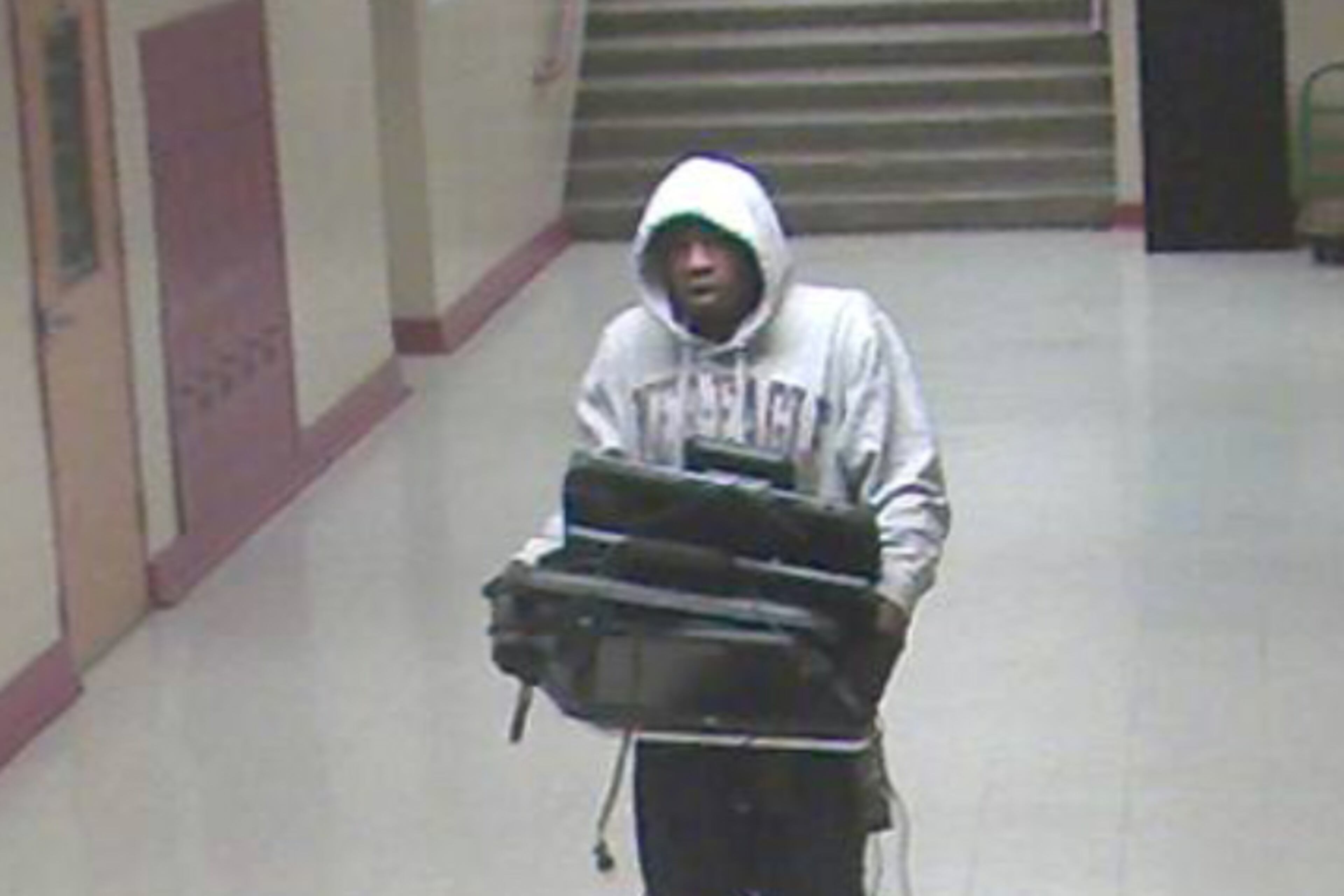 Atlanta police have released pictures captured by surveillance cameras of four men who may have taken more than 100 computers from Brown Middle School west of downtown Atlanta. (Atlanta Police Department)