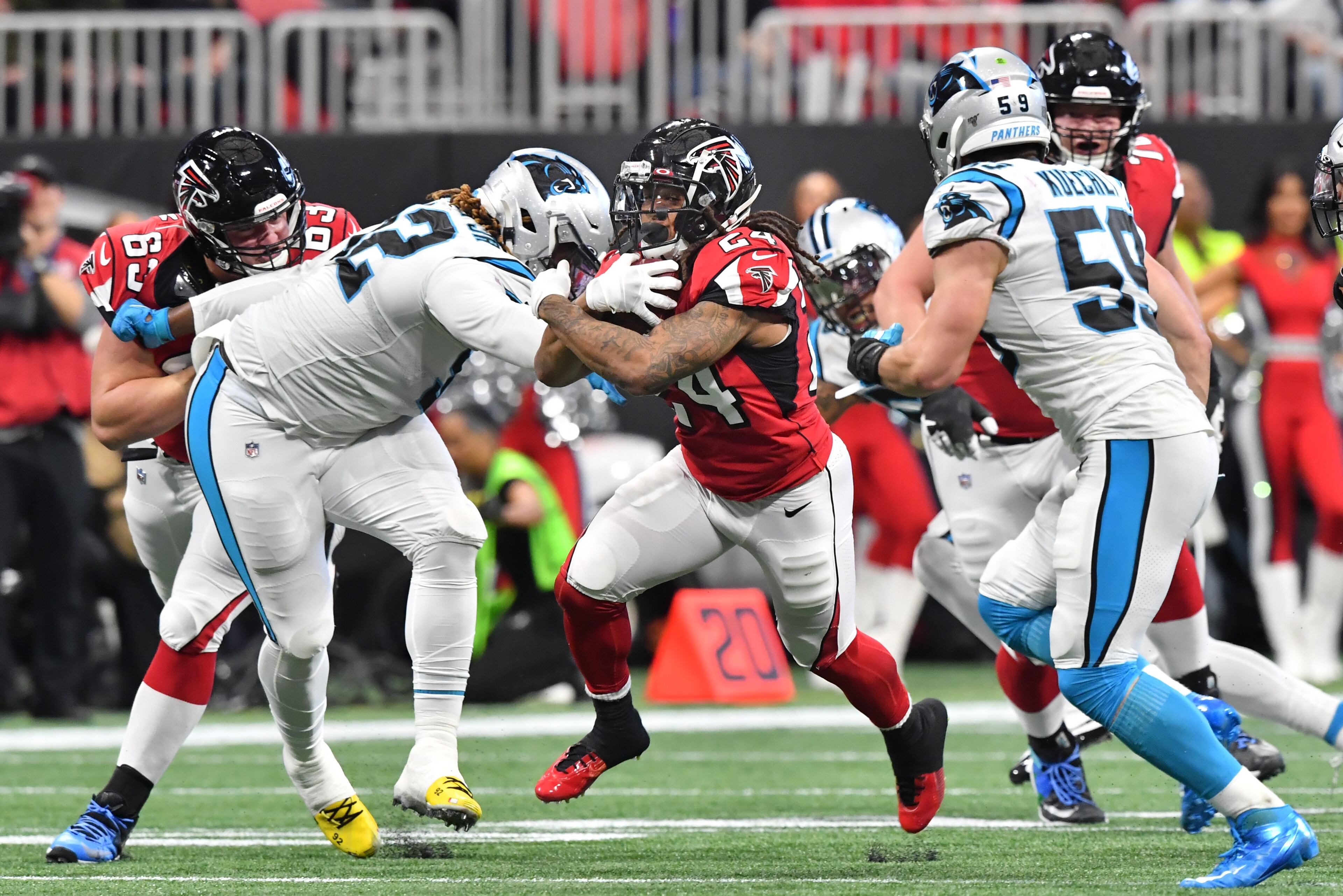 December 8, 2019 Atlanta - Atlanta Falcons running back Devonta Freeman (24) breaks away for a first down during the first half in a NFL football game at Mercedes-Benz Stadium on Sunday, December 8, 2019. (Hyosub Shin / Hyosub.Shin@ajc.com)