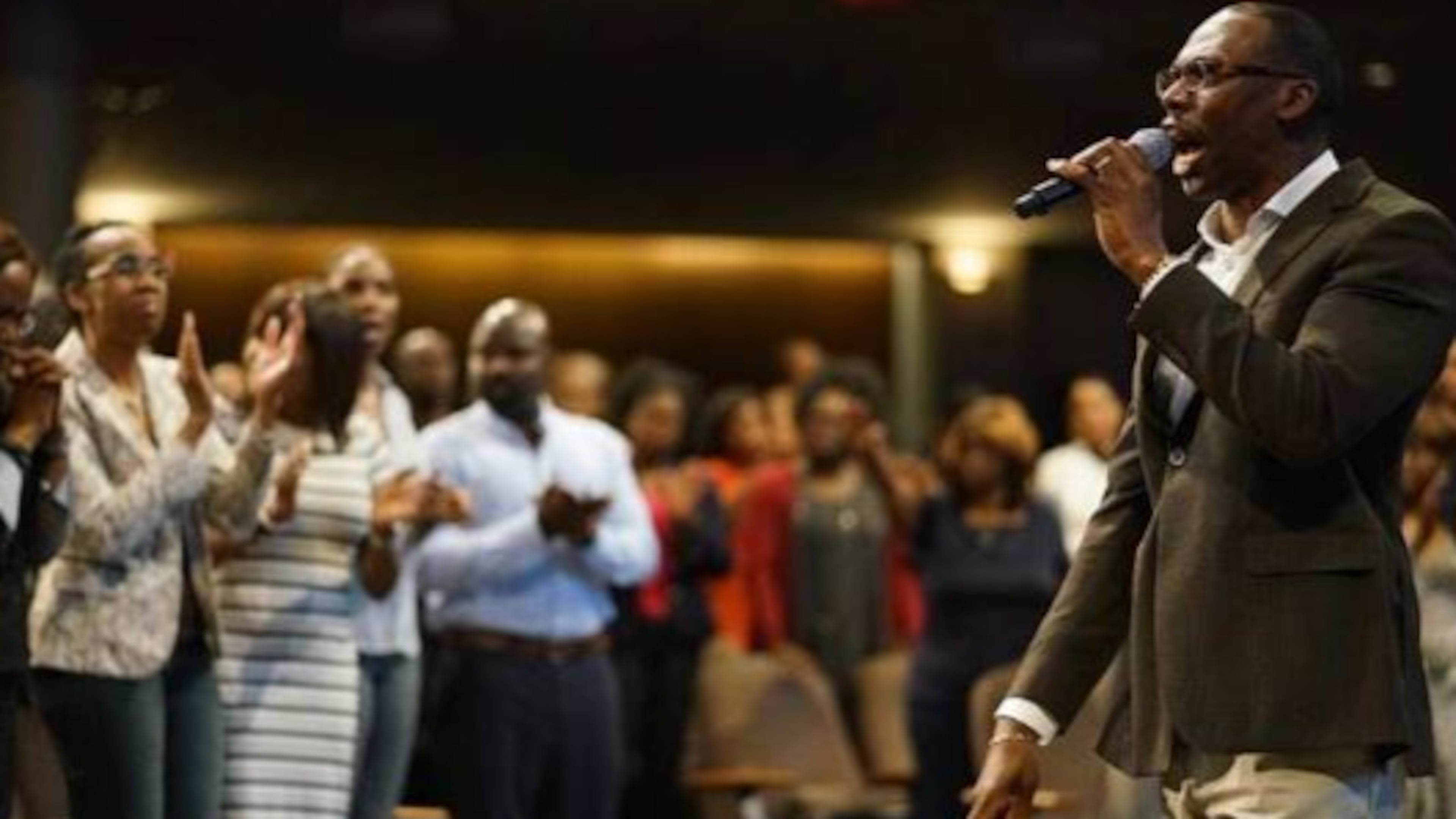 Bishop Stephen A. Davis delivers a message to the congregation of New Birth Missionary Baptist Church.