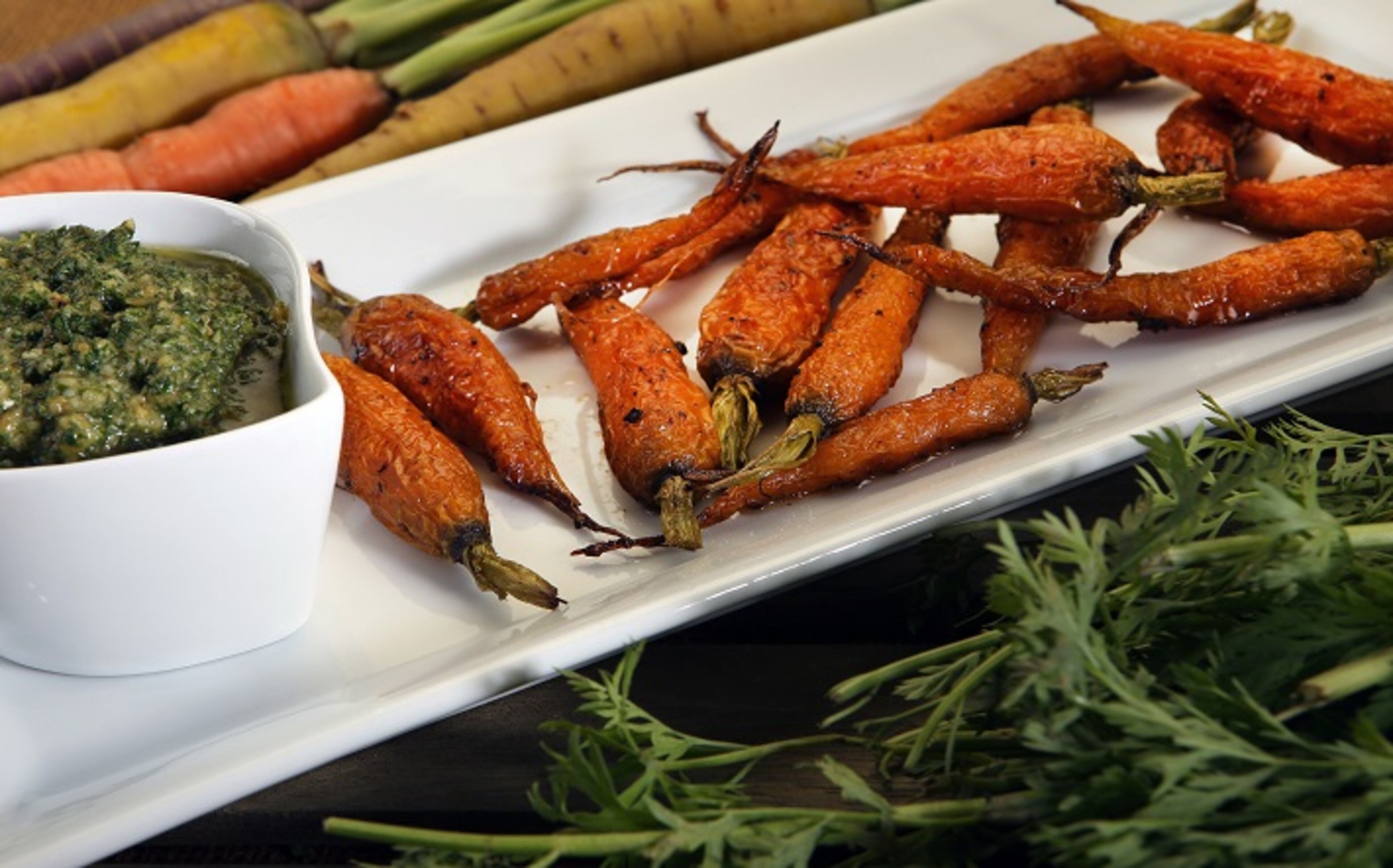 Roasted carrots with carrot top pesto. (Glenn Koenig/Los Angeles Times/TNS)