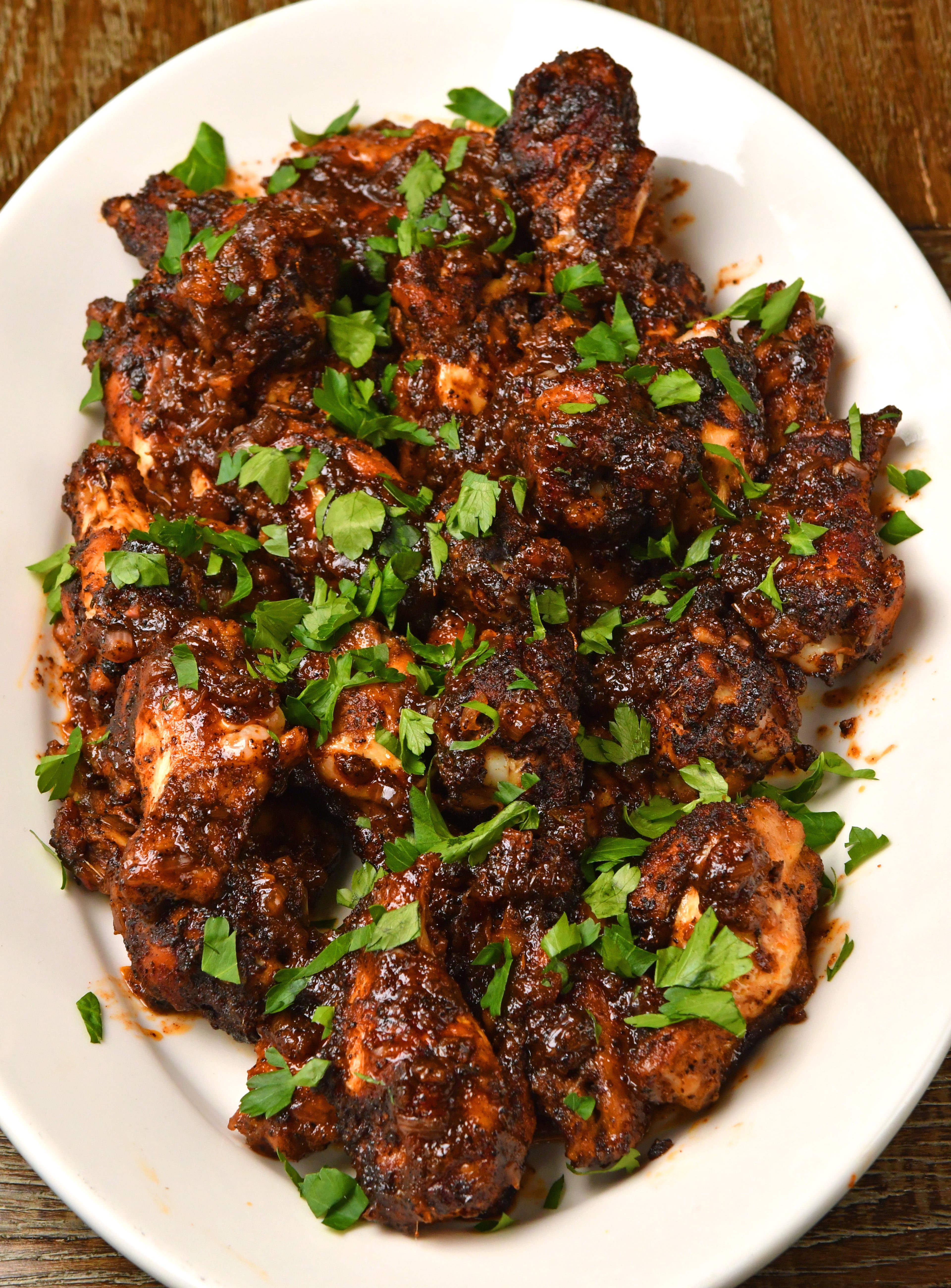 Chile Coffee Sticky Wings, by Adriana Frazier, director of operations and innovation of Suwanee-based Volcanica Coffee, are bursting with flavors — sweet and savory, but also spicy. (Styling by Adriana Frazier / Chris Hunt for the AJC)