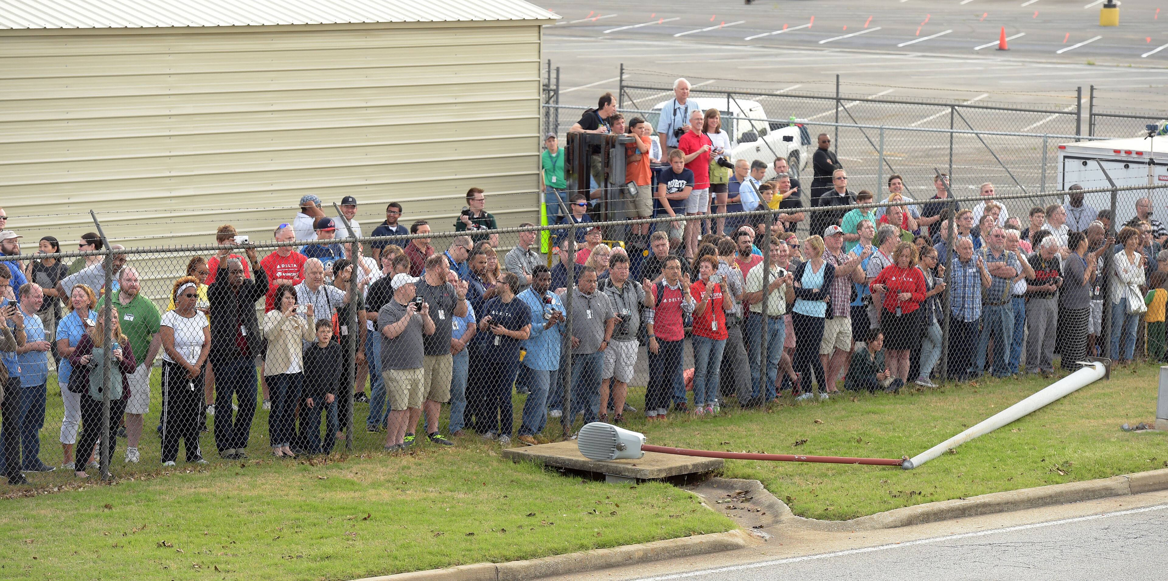APRIL 30, 2016 ATLANTA Spectators watch as crews move a retired Boeing 747-400 to the Delta Flight museum Saturday, April 30, 2016. KENT D. JOHNSON /kdjohnson@ajc.com #delta747experience