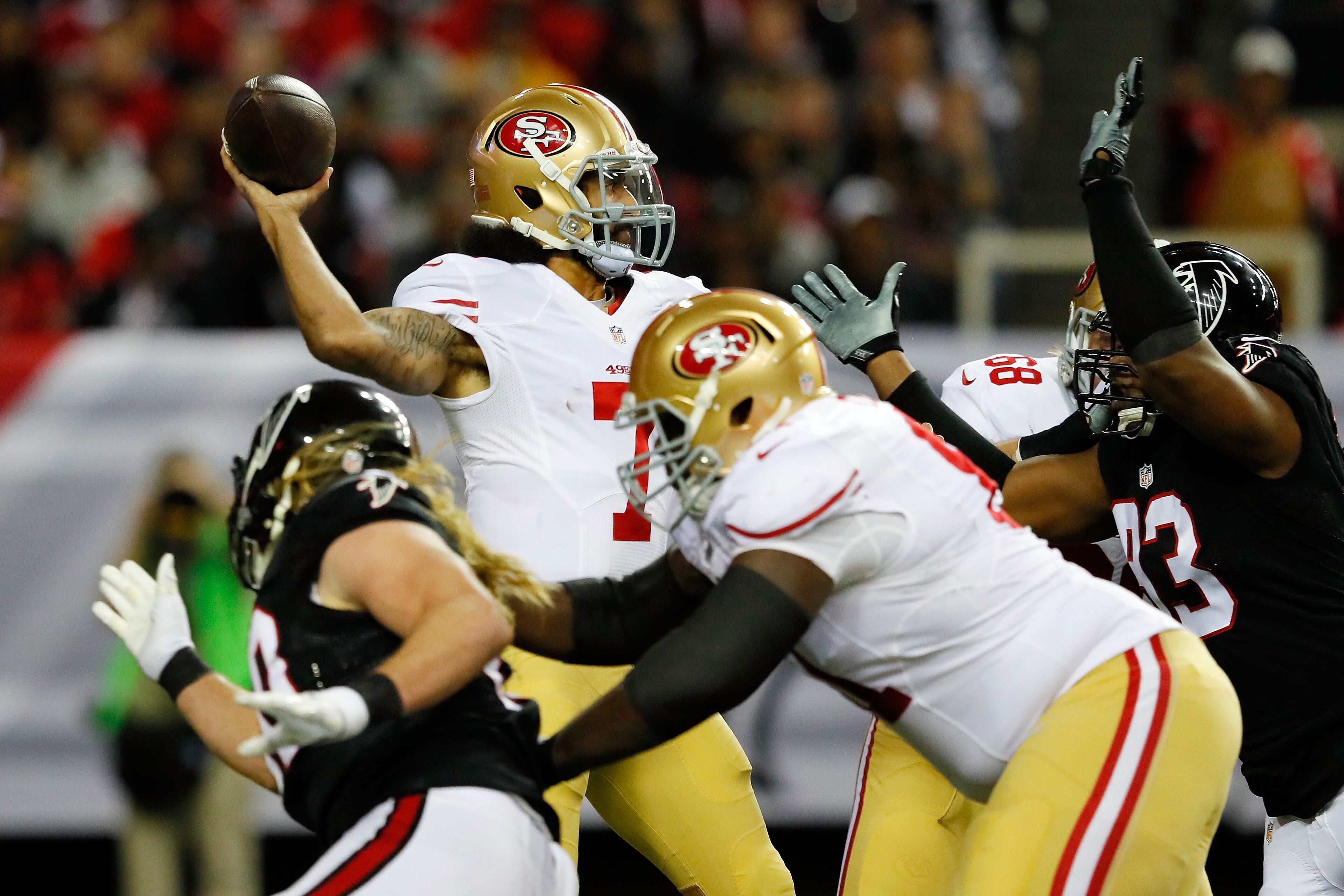 ATLANTA, GA - DECEMBER 18: Colin Kaepernick #7 of the San Francisco 49ers passes under pressure during the first half against the Atlanta Falcons at the Georgia Dome on December 18, 2016 in Atlanta, Georgia. (Photo by Kevin C. Cox/Getty Images)