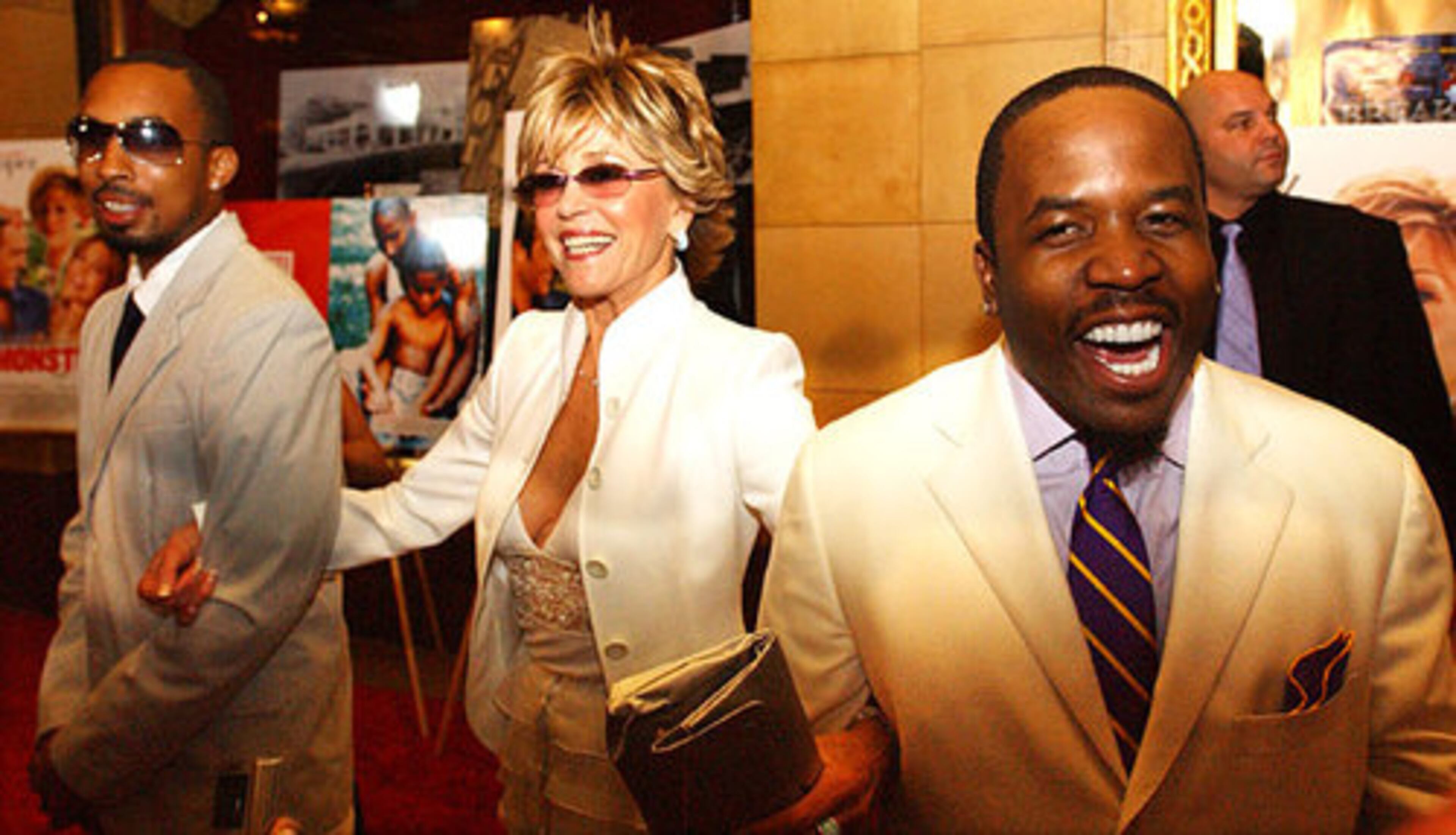 Fonda linked arms with music producer Dallas Austin, left, and Big Boi of Outkast on the red carpet for the east coast premiere of "Monster in Law" at the Fox Theatre in 2005.