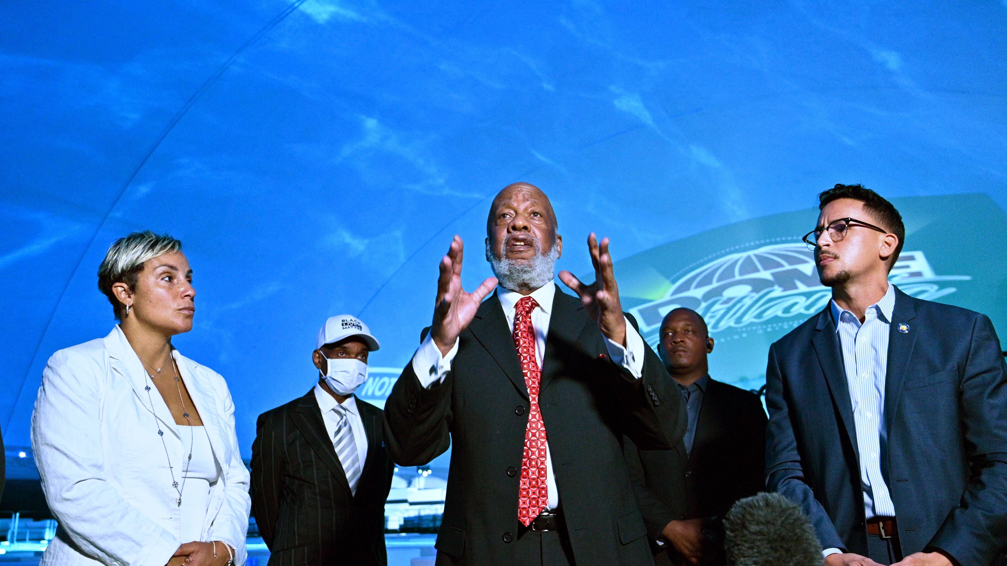 May 25, 2021 Atlanta - Bishop JohnÊH.ÊLewis, chairman of theÊVine CityÊCivic Association, speaks as Michelle Falconer (left) and AtlantaÊCityÊCouncilman Antonio Brown look during a press conference Inside Dome Atlanta, transient event venue, across the street from the Mercedes-Benz Stadium on Tuesday, May 25, 2021. Dome in the City is a state-of-the-art DIGITAL event center. Twenty four projectors illuminate the entire interior and exterior of this temperature-controlled, transient venue, according to their website. (Hyosub Shin / Hyosub.Shin@ajc.com)